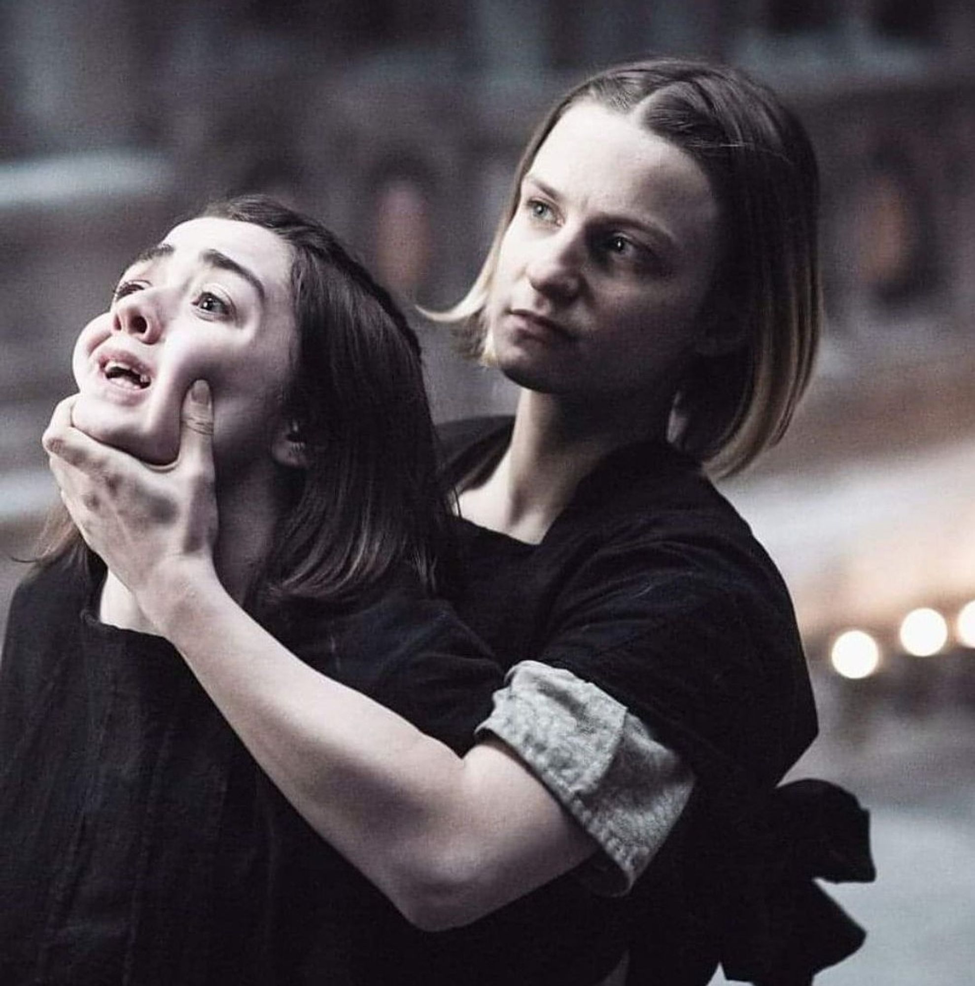 Arya Stark form Game of Thrones being physically forced to look at something by The Waif.  Arya is not happy about it.