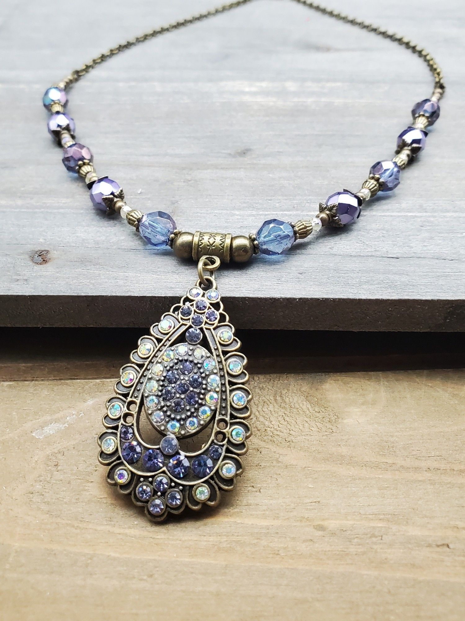 Antique looking purple and bronze rhinestone necklace.