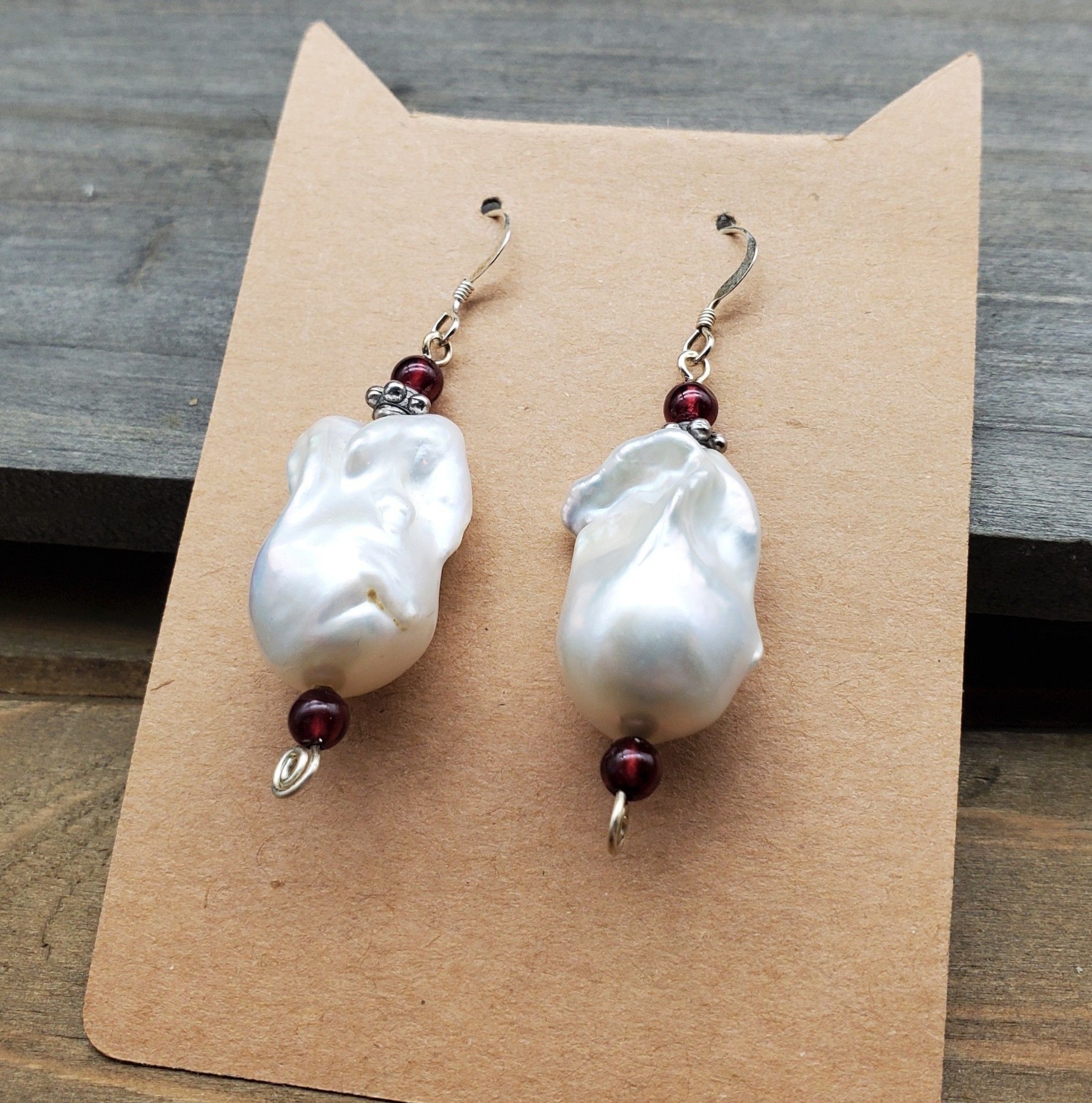 Large baroque pearl earrings with Garnet.