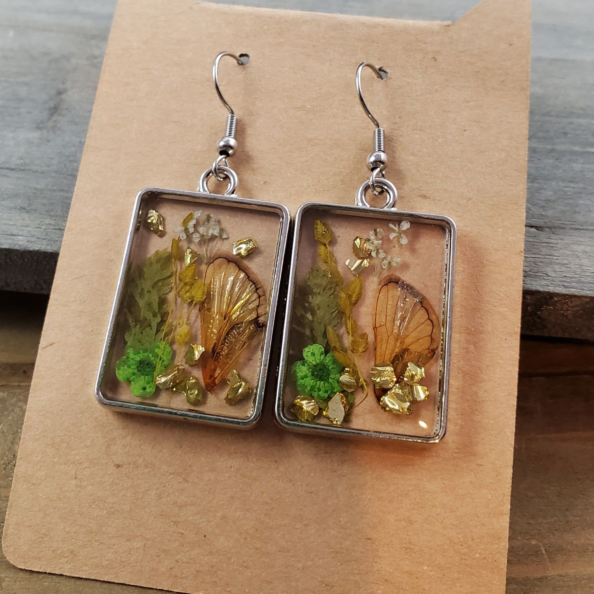 Resin cicada earrings with flowers and leaves