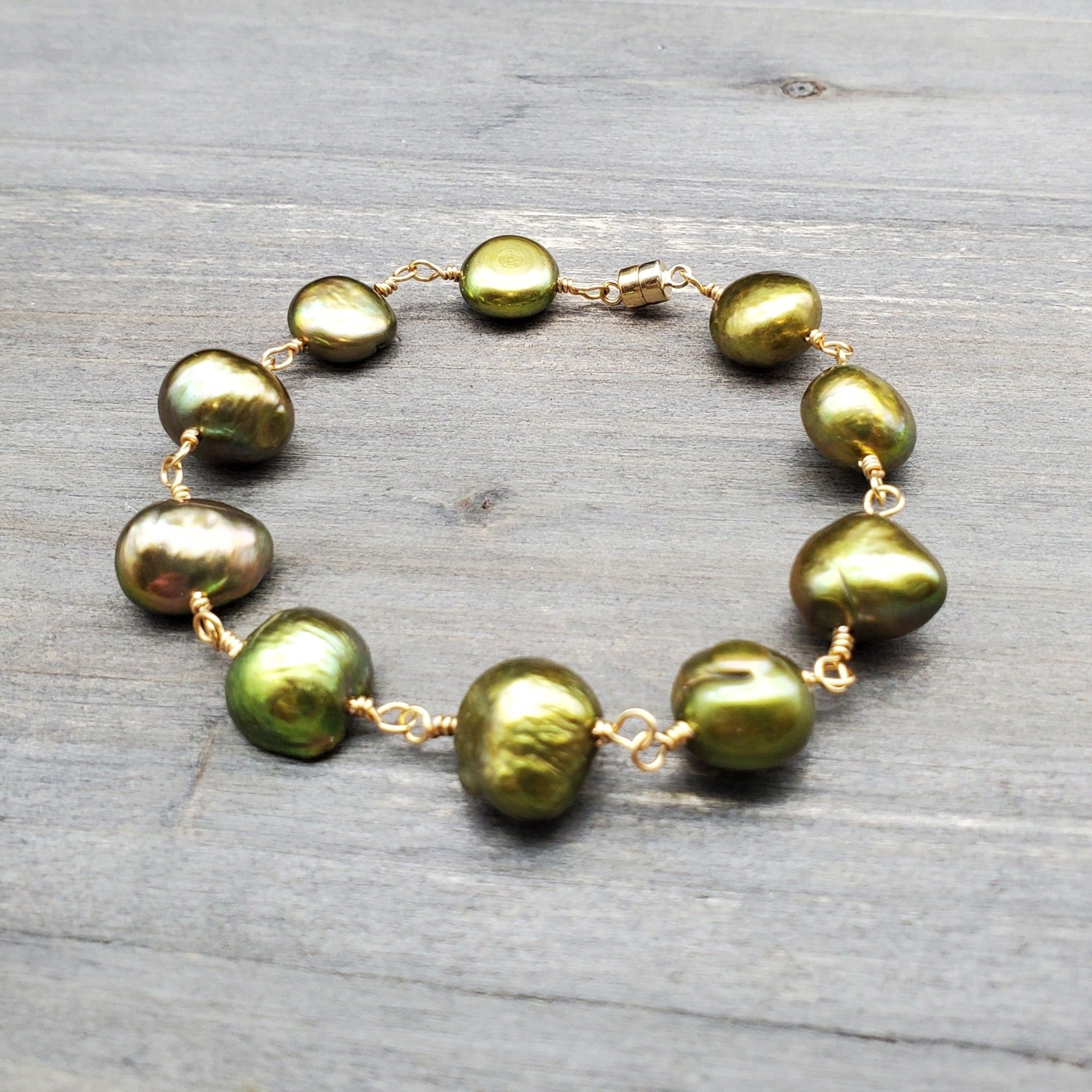 A chartreuse pearl bracelet with gold wire