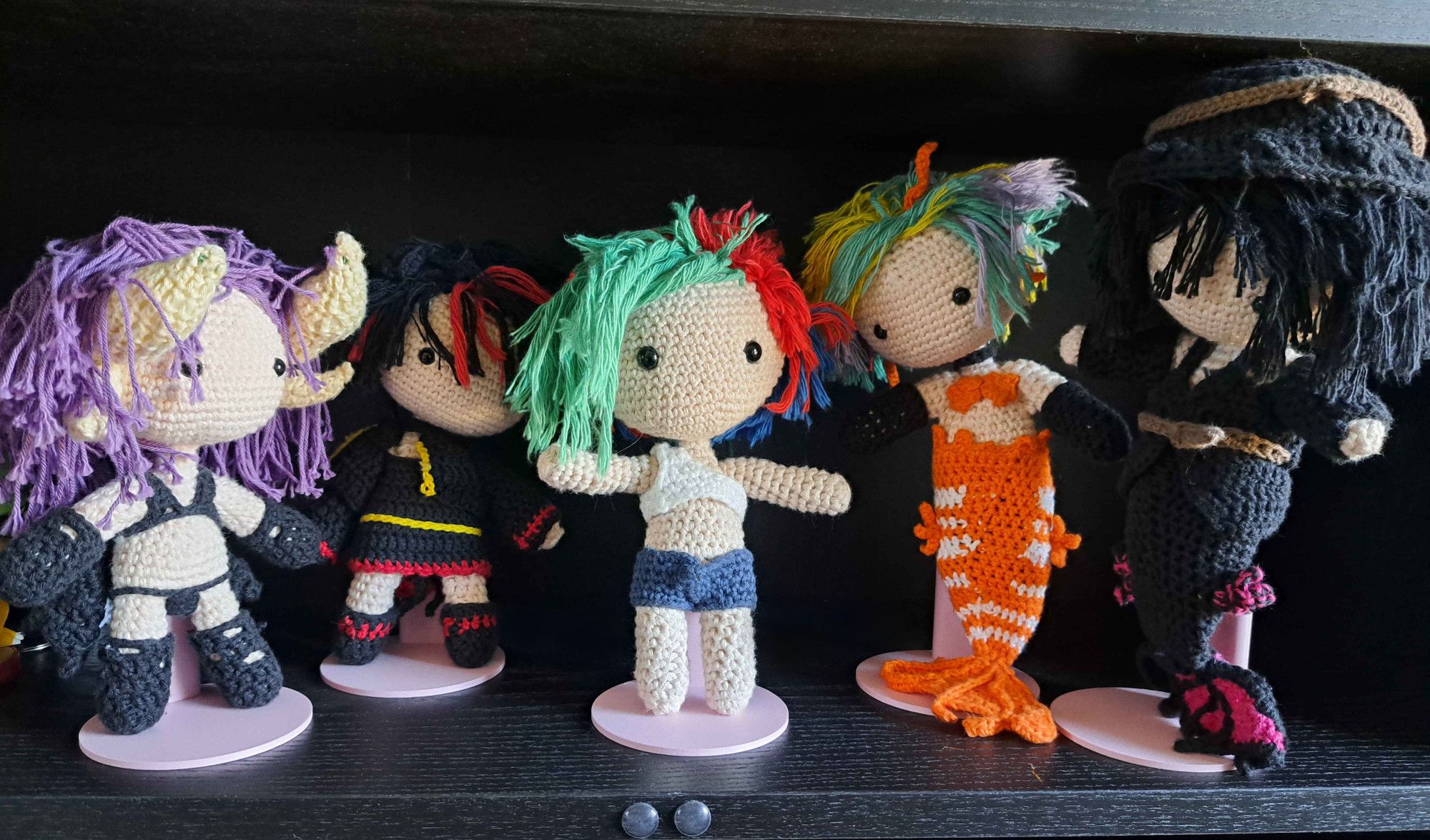 5 puppets from characters of the changefairy universe, left: A very cute purple haired horned beauty in lingerie, a rockstar lady with blue red hair, a punk with green red and blue hair who stands in the middle and is really important, NiXXXy Seastar a Lionfish Mermaid and her girlfriend Oceanida Tintenfisch a Betta mermaid.