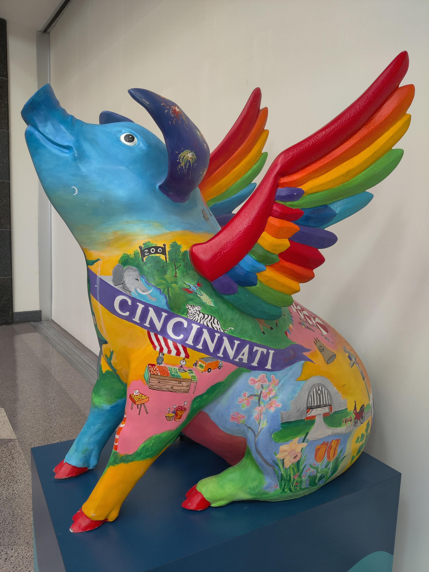 One of many flying pig statues in Cincinnati, this one bedecked with rainbow colors and cityscapes.