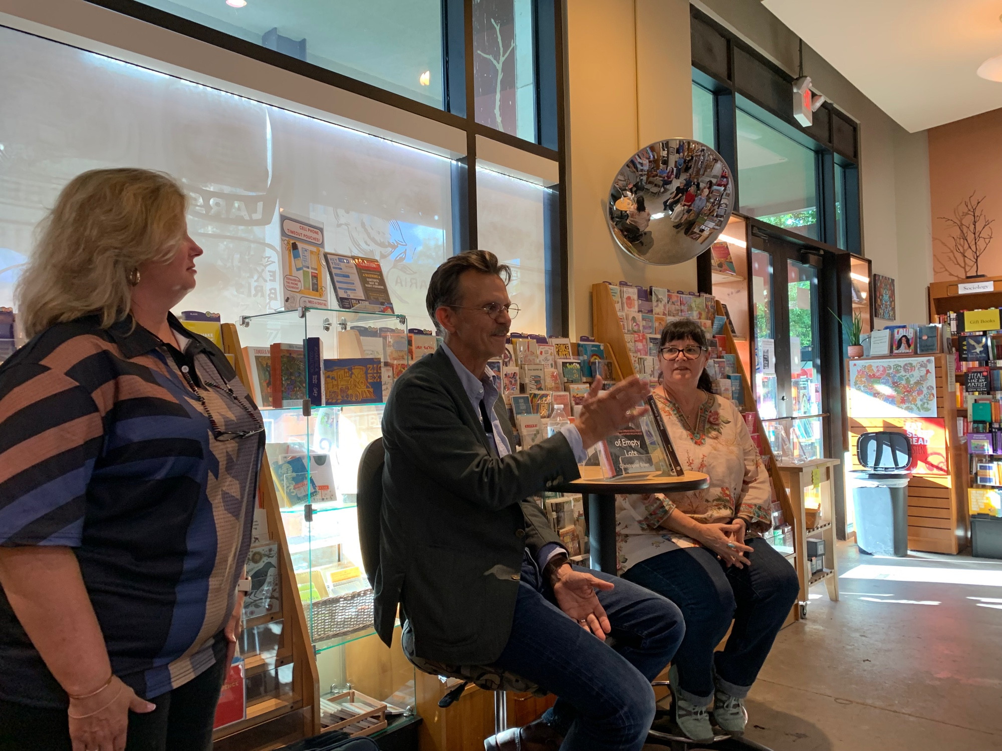 Christopher Brown and Jennifer Bristol sitting at a table in a bookstore addressing the audience out of frame