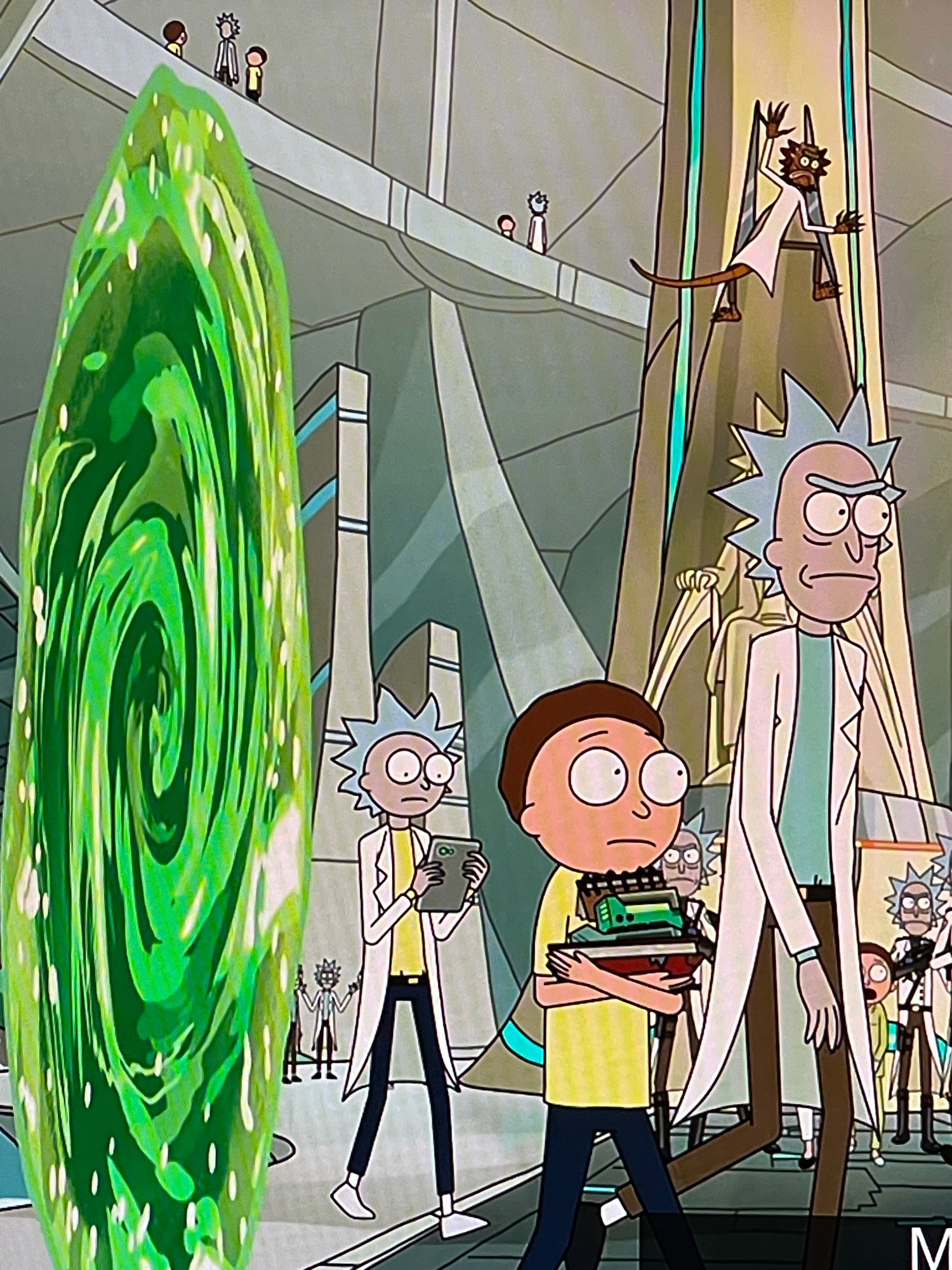 What appears to be a combination of both Rick and Morty in a smaller version of a Morty-dressed body, but with a labcoat and Rick hair and a Morty face/eyes