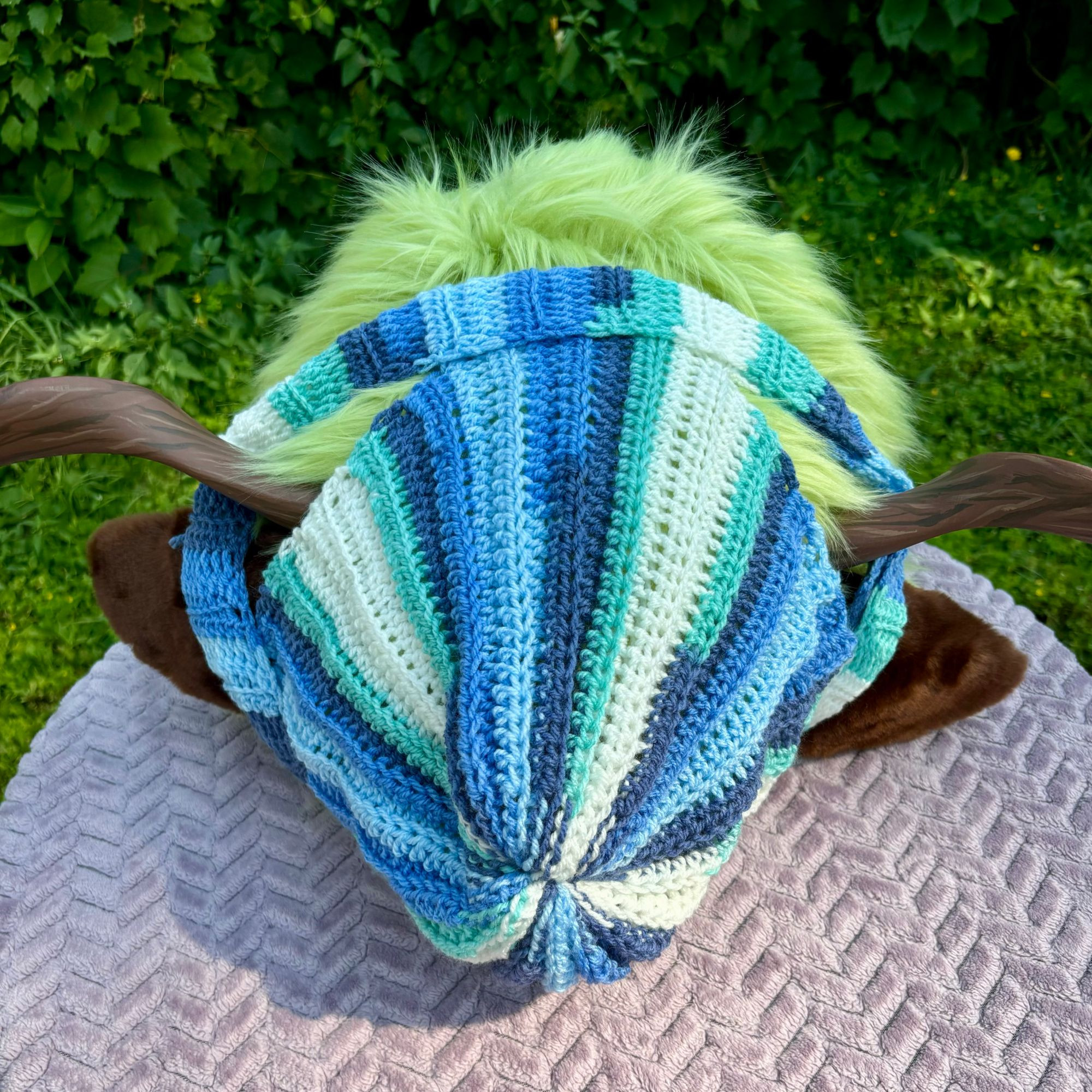 blue white and cyan striped fursuit beanie view from the back