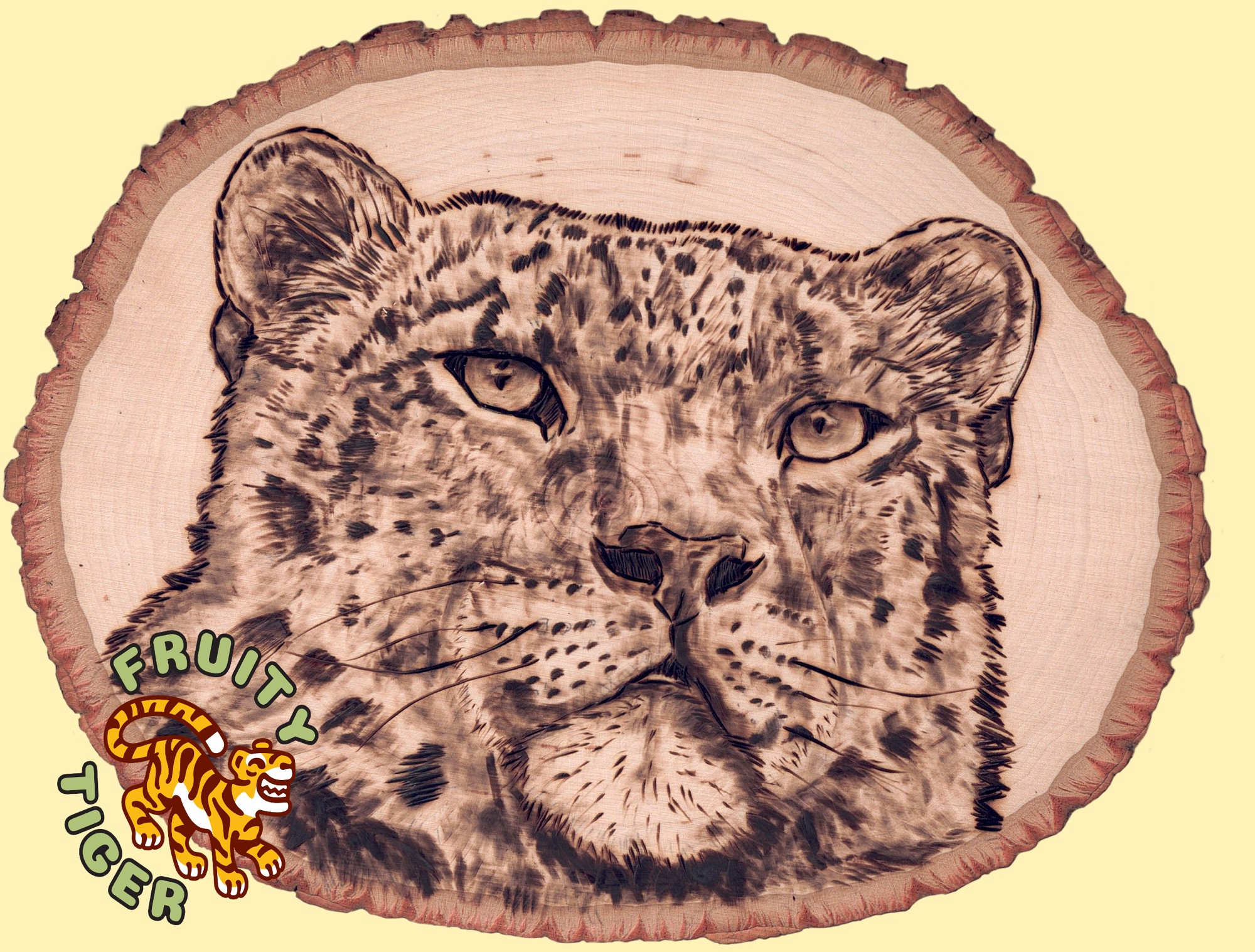 a woodburning on live edge wood of a snow leopard staring directly into your soul