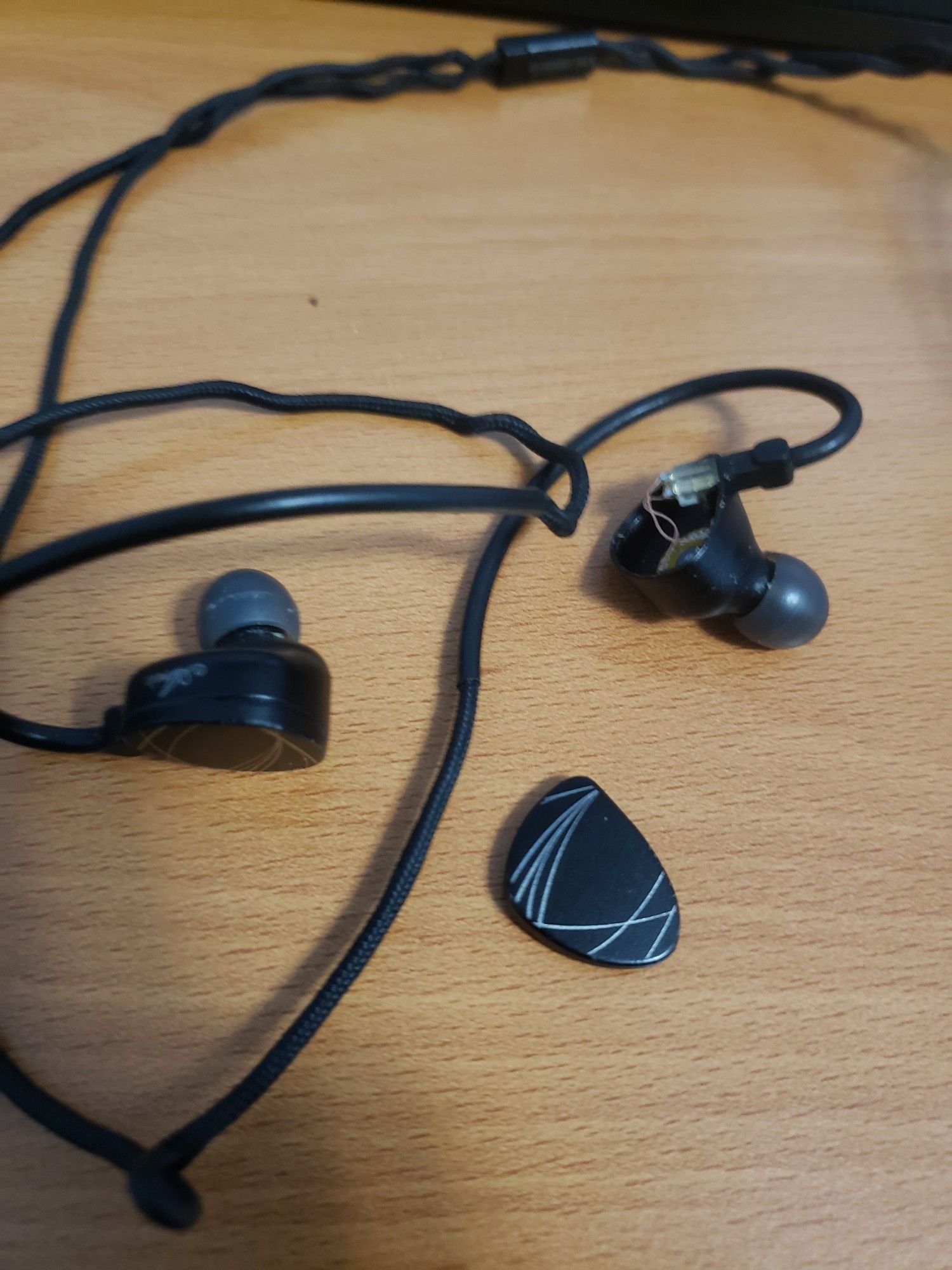 moondrop aria in ears with the casing broken apart