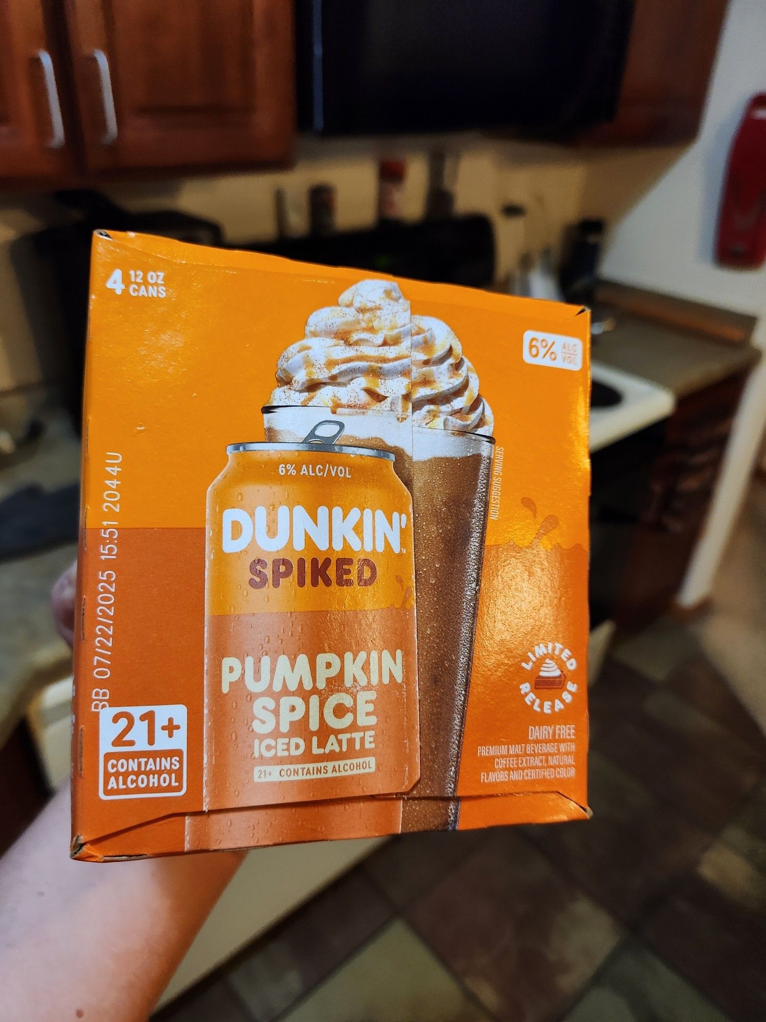 A four can box of Dunkin' Donuts Pumpkin Spice Iced Latte that contains Alcohol.