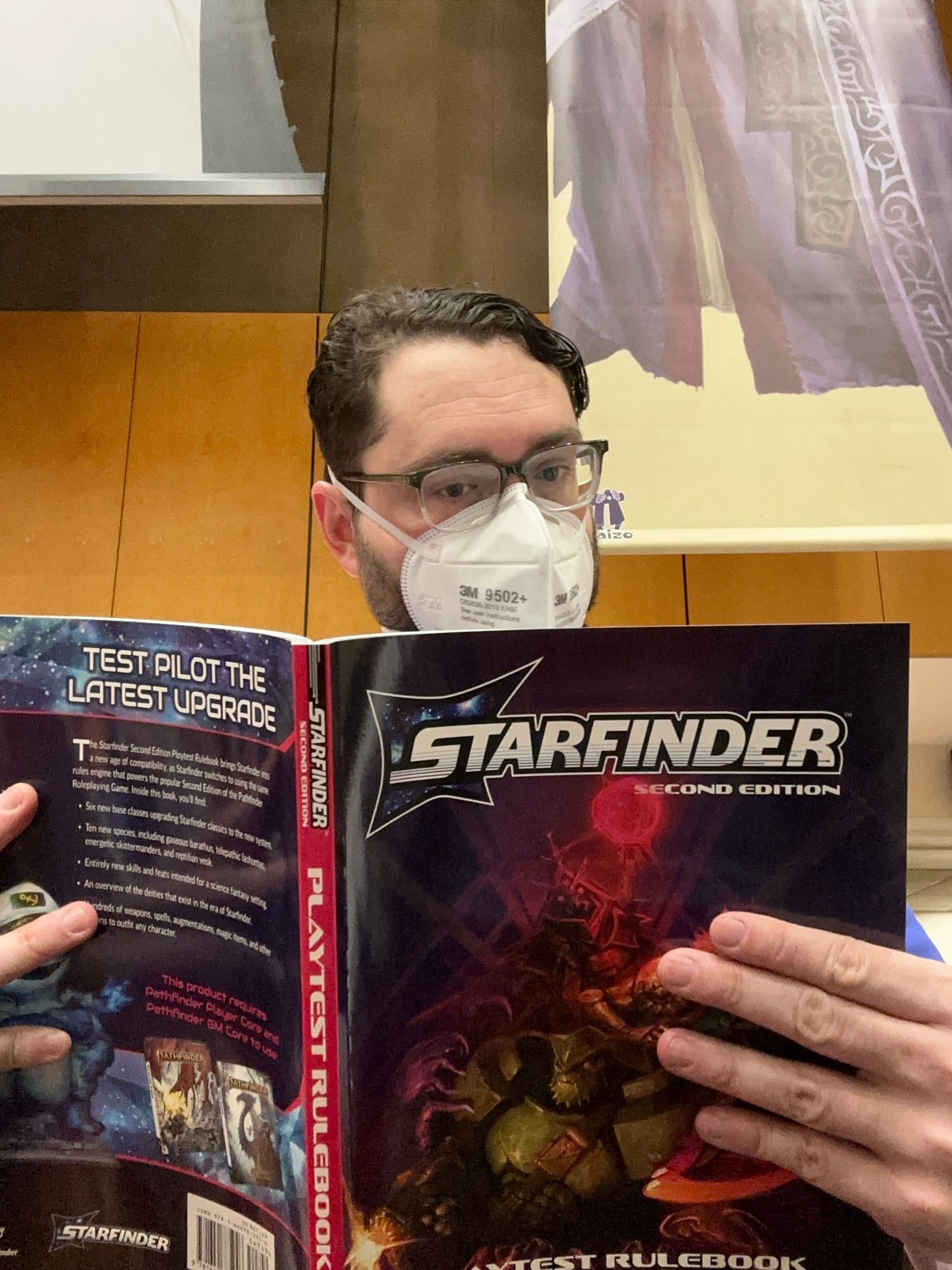 Me looking at the Starfinder Playtest book!