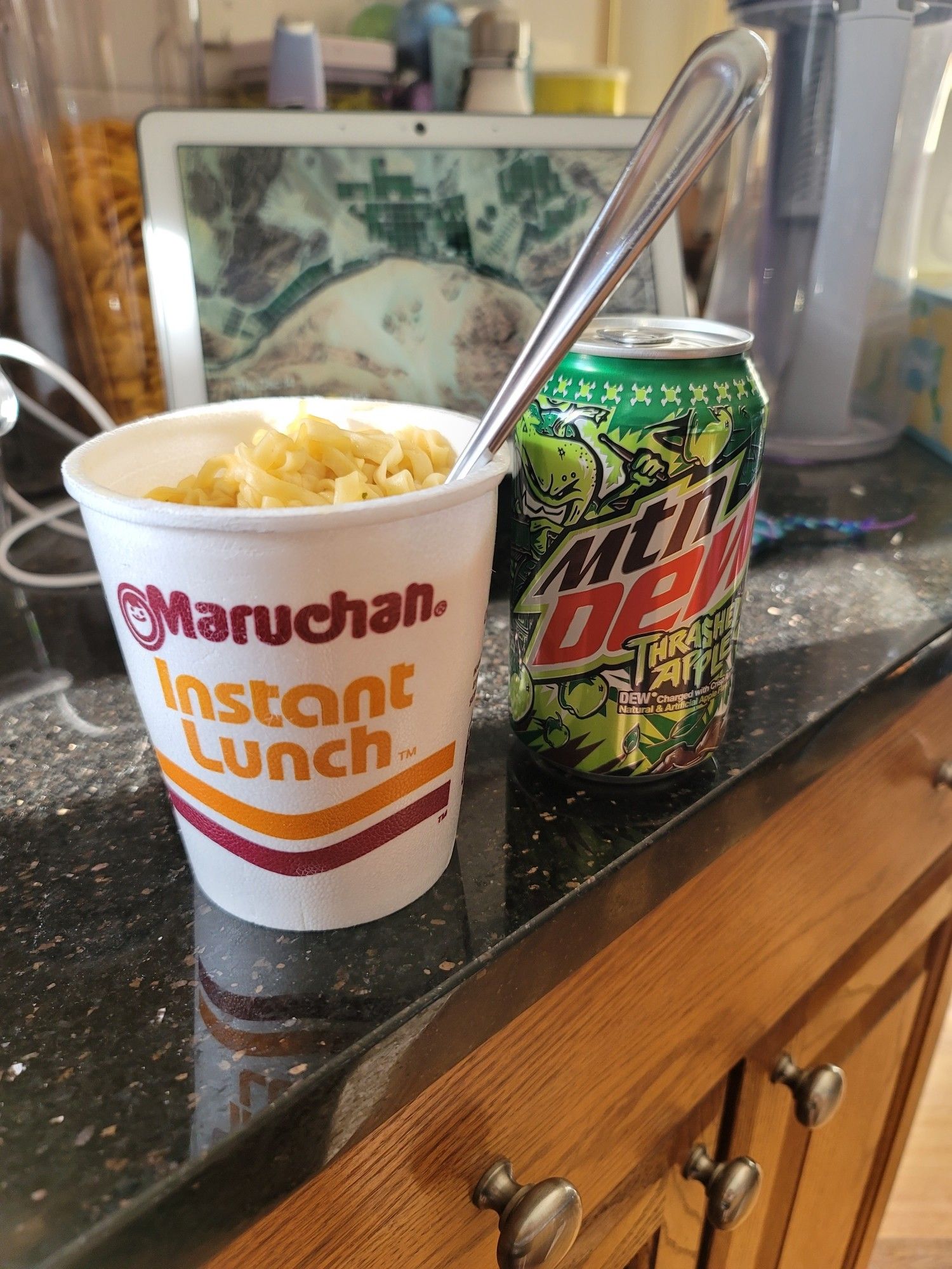 Cheddar cheese instant ramen and an expired apple Mountain Dew