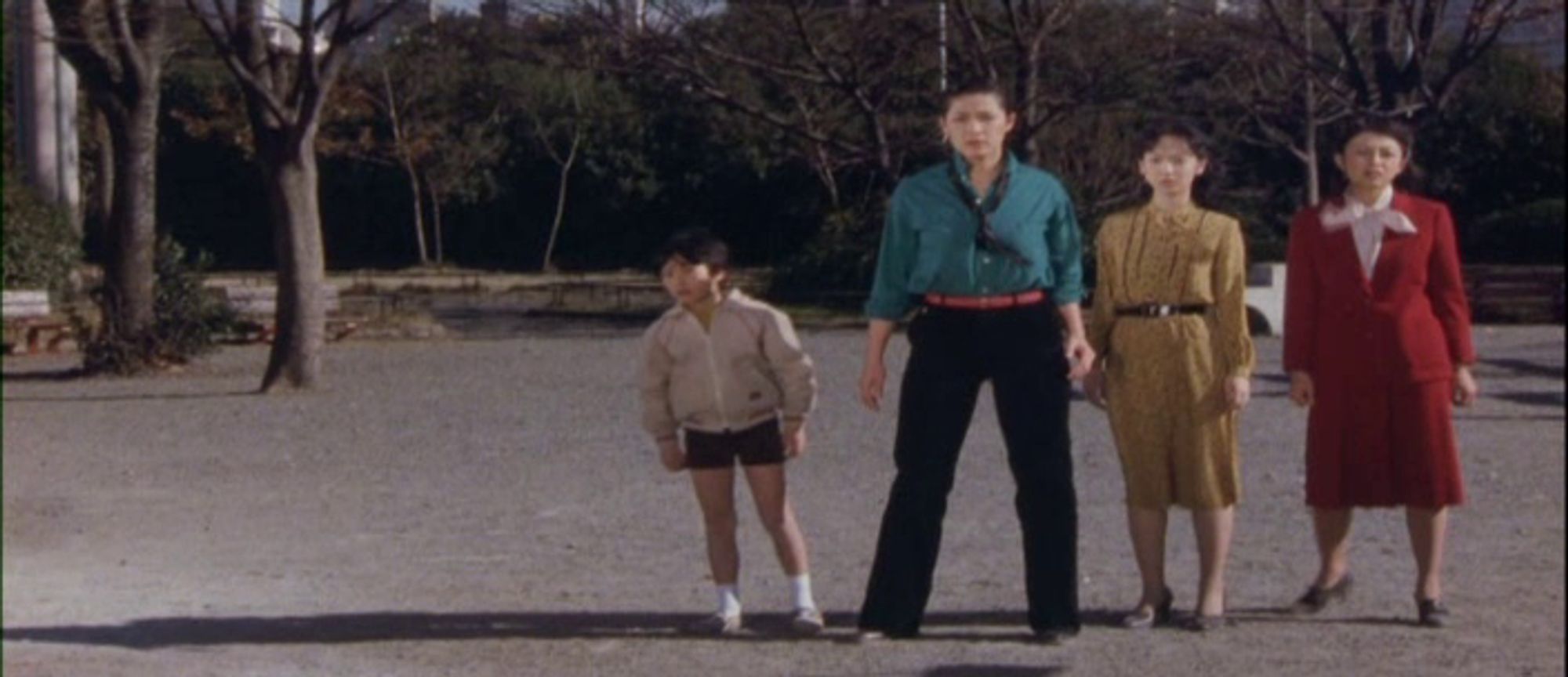 Still from Gamera: Super Monster depicting the Spacewomen in civilian guise, looking three different flavors of fly. Keiichi's there, too, looking like a nerd.