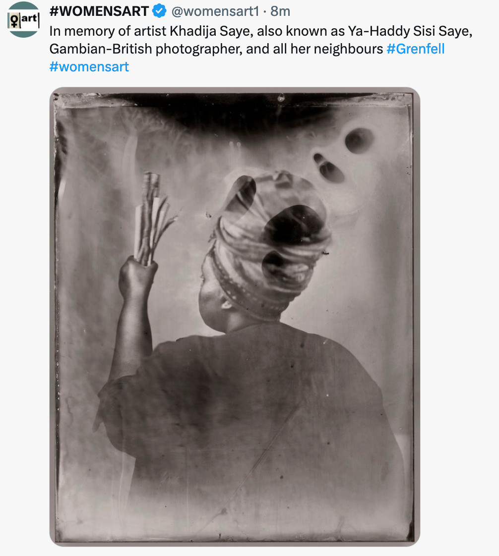 Screenshot of a tweet from Women's Art. The Tweet reads n memory of artist Khadija Saye, also known as Ya-Haddy Sisi Saye, Gambian-British photographer, and all her neighbours. 
A copy of her silkscreen print "Sothiou" is attached. This is one of a series of artworks in which Khadija explored her identity, heritage and mixed faith background, her parents came from The Gambia; but her mother was a Christian and her father was a Muslim. She used objects in the images to convey her connection to traditional Gambian spiritual rituals – from purification to protection. 
The print is black & white, Khadija is facing away from the viewer, her hair is swept up in a scarf and she is looking at the sticks held in her raised left hand. Her stance implies that a ritual is about to begin.