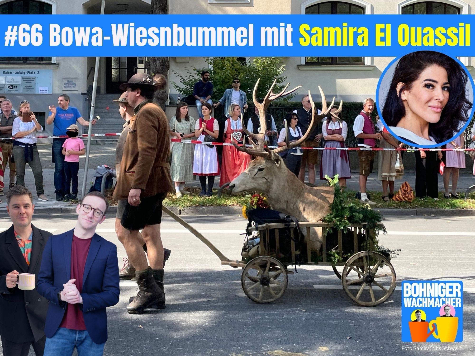 Foto vom Trachtenumzug des Oktoberfest: Ein Hirschkopf wird auf einem kleinen Wagen von Männern in Lederhosen gezogen.

Zeile: Folge 66, Bowa-Wiesnbummel mit Samira El Ouassil