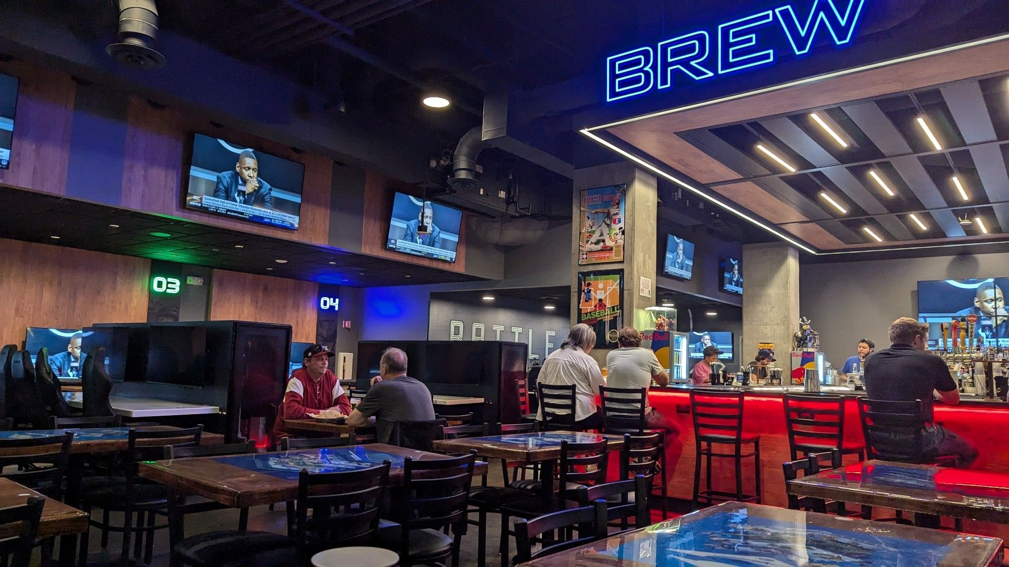 Generic looking bar with ESPN on the TVs and some gaming posters