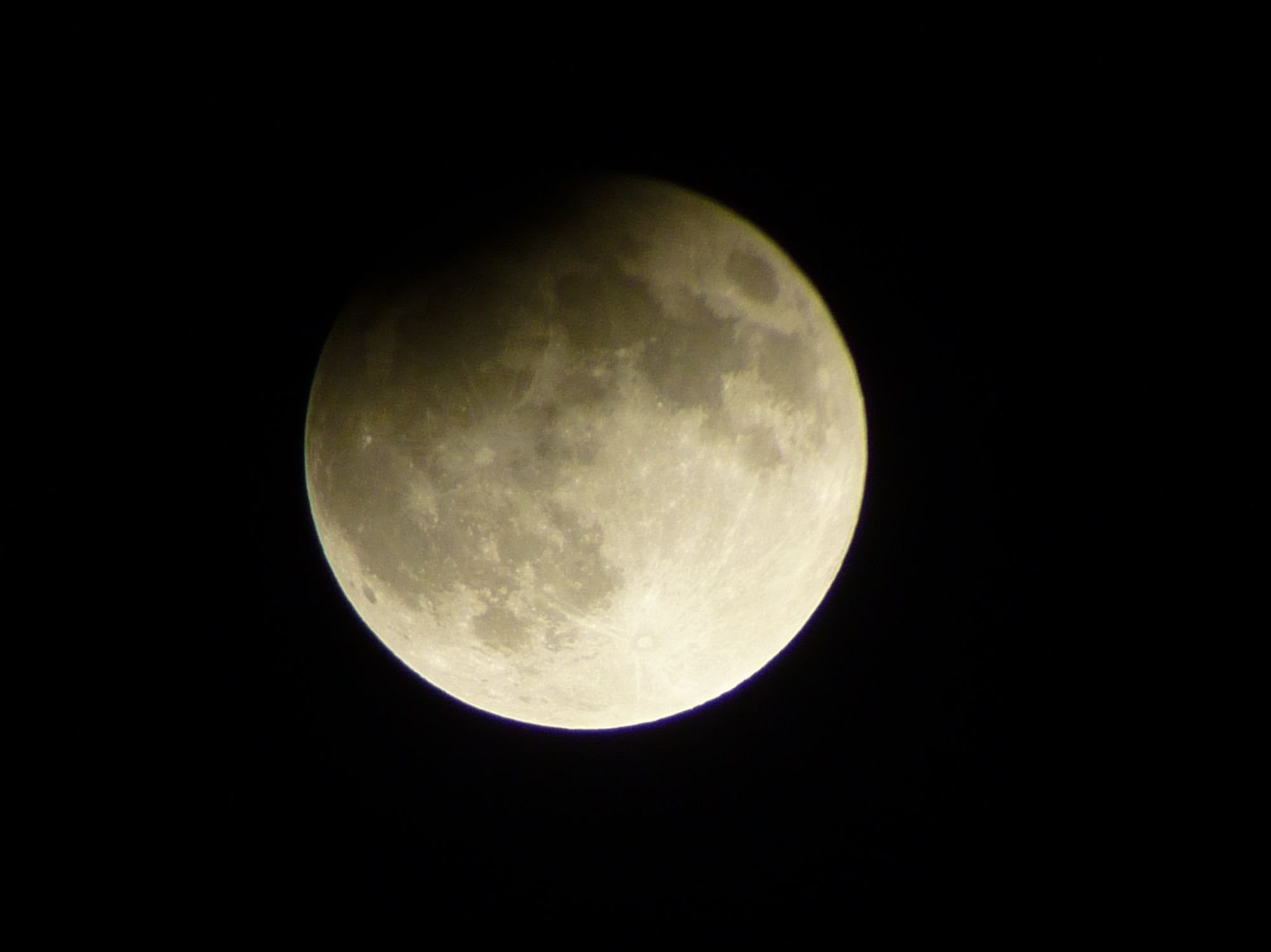 A photo of the partially eclipsed moon.