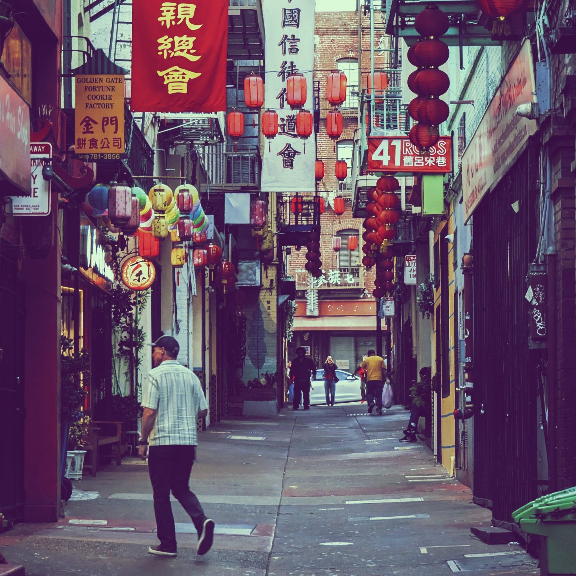 The profusion of signs and colors lining Ross Alley are mostly in Chinese with some English. Just ask for someone to point you to the fortune cookie factory, you'll find it.