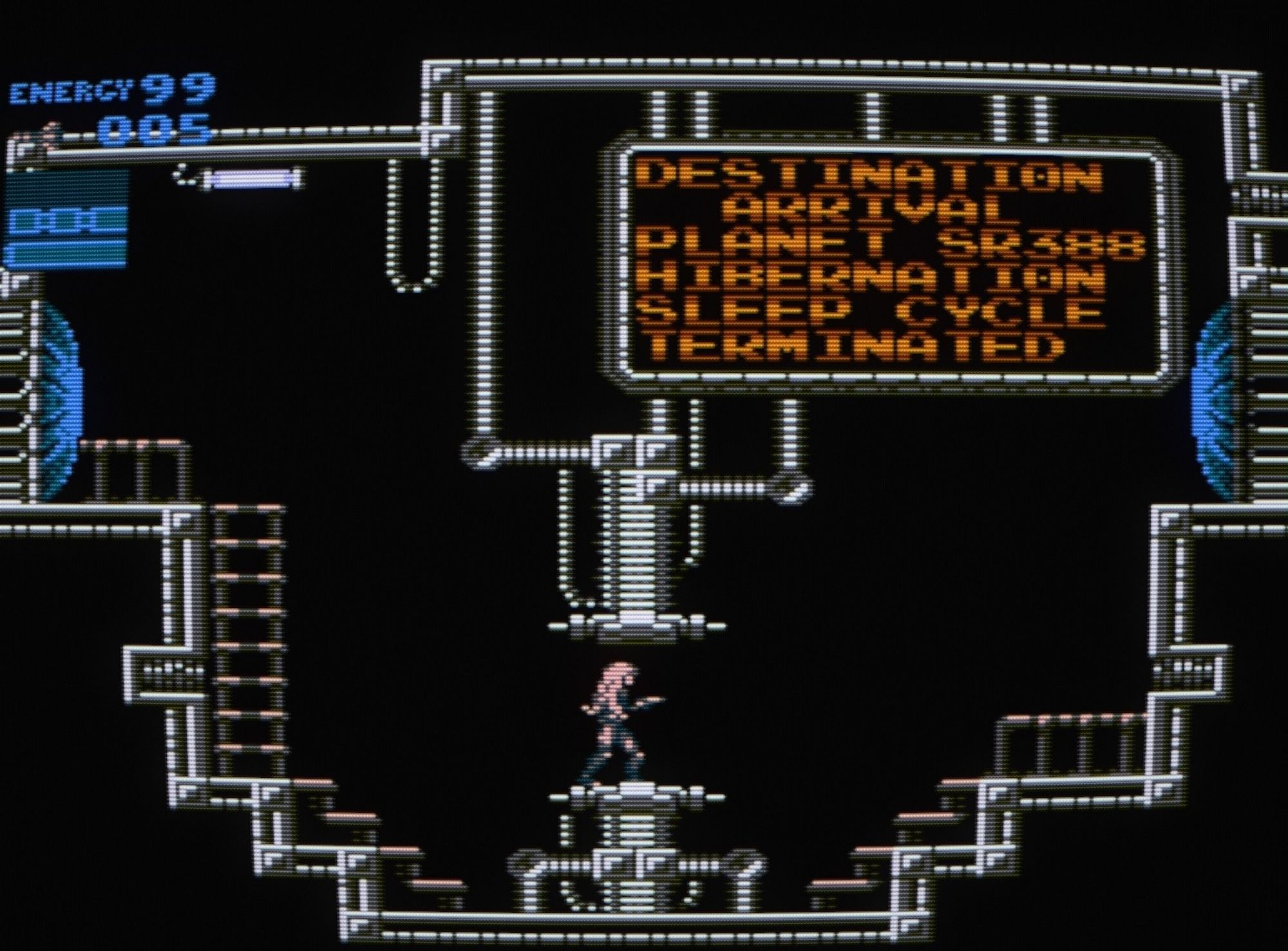 Destination - Arrival - Planet SR388 - Hibernation Sleep Cycle Terminated. With slightly darker, long hair and wearing a grey Zero Suit, Samus awakens on the space pirate vessel. It's a romhack of the original NES Metroid and a pretty radical one at that.