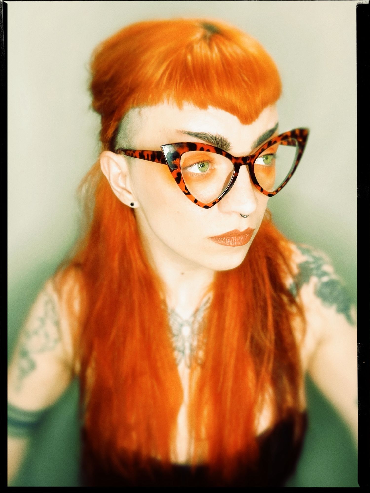 Self portrait of me. Long orange hair, orange cat eye tortoiseshell glasses