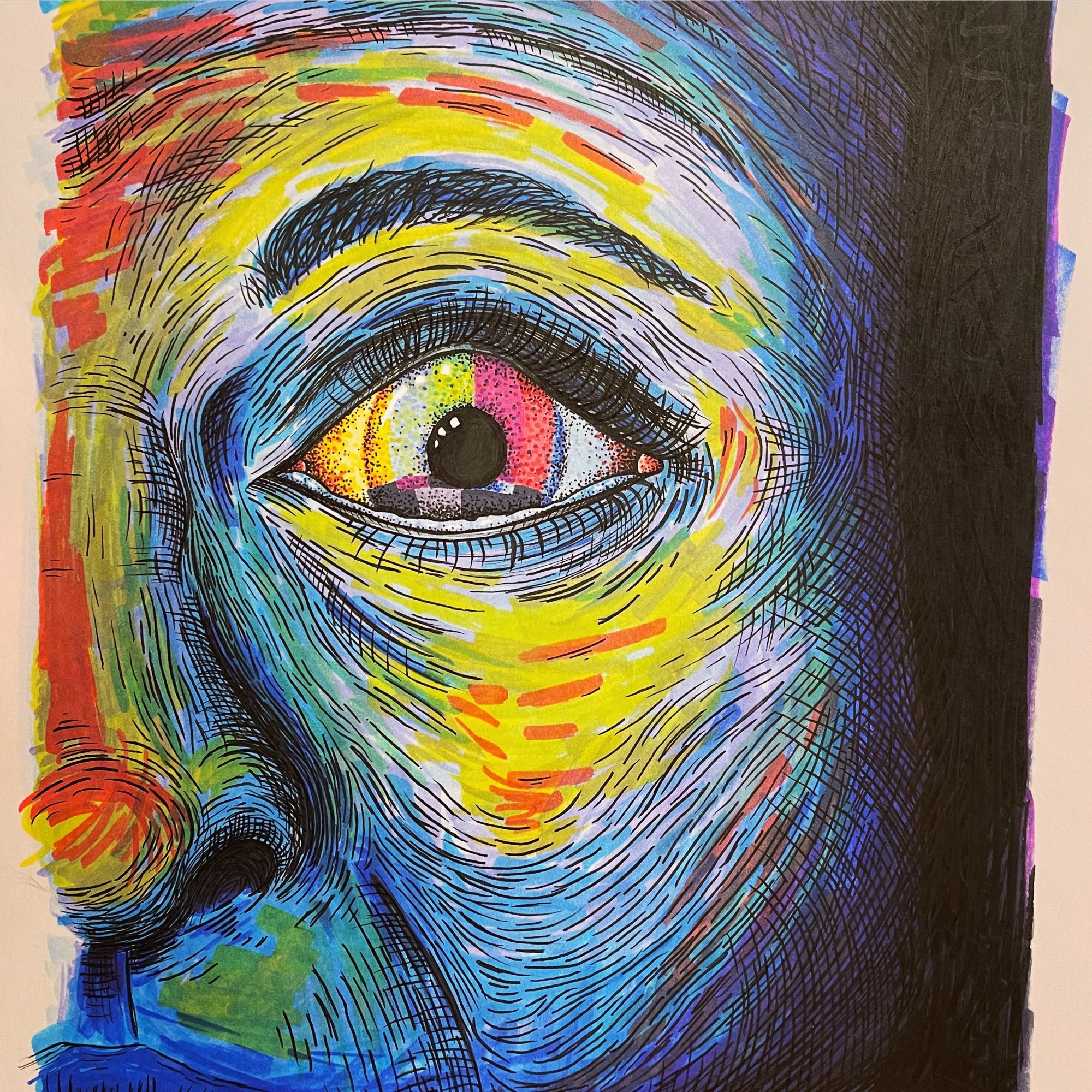 Multicolored face and eye in blue and yellow tones.