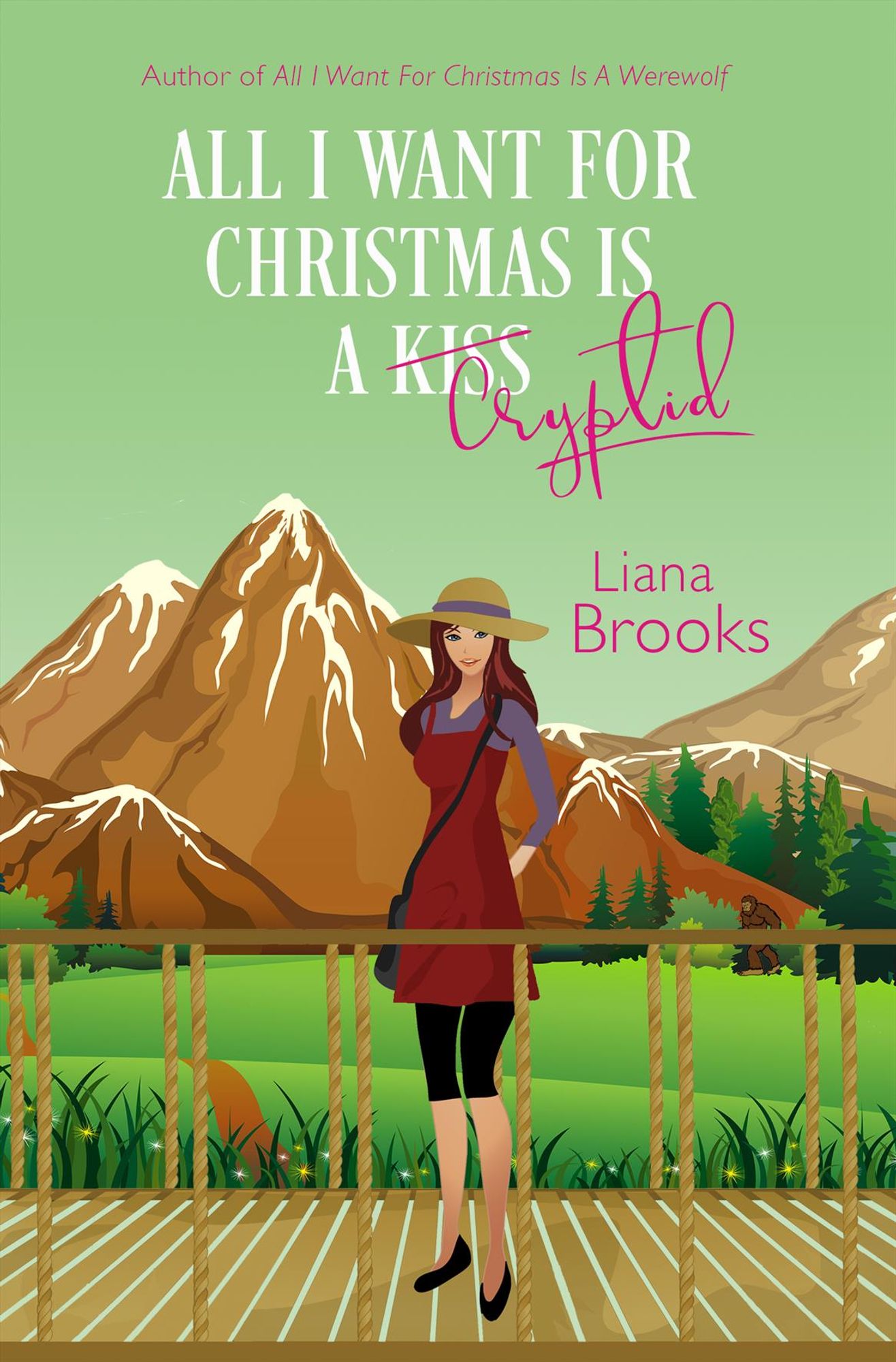 The cover art for All I Want For Christmas Is A Cryptid - a cartoon of a woman with dark red-brown hair wearing a straw sunhat, a blueberry purple shirt, a brick brown sleeveless dress, with black leggings and black shoes stands on a wooden bridge with a green field and brown, snow-capped mountains behind her. The background color is green and the title is written in white with the word Cryptid in pink.  