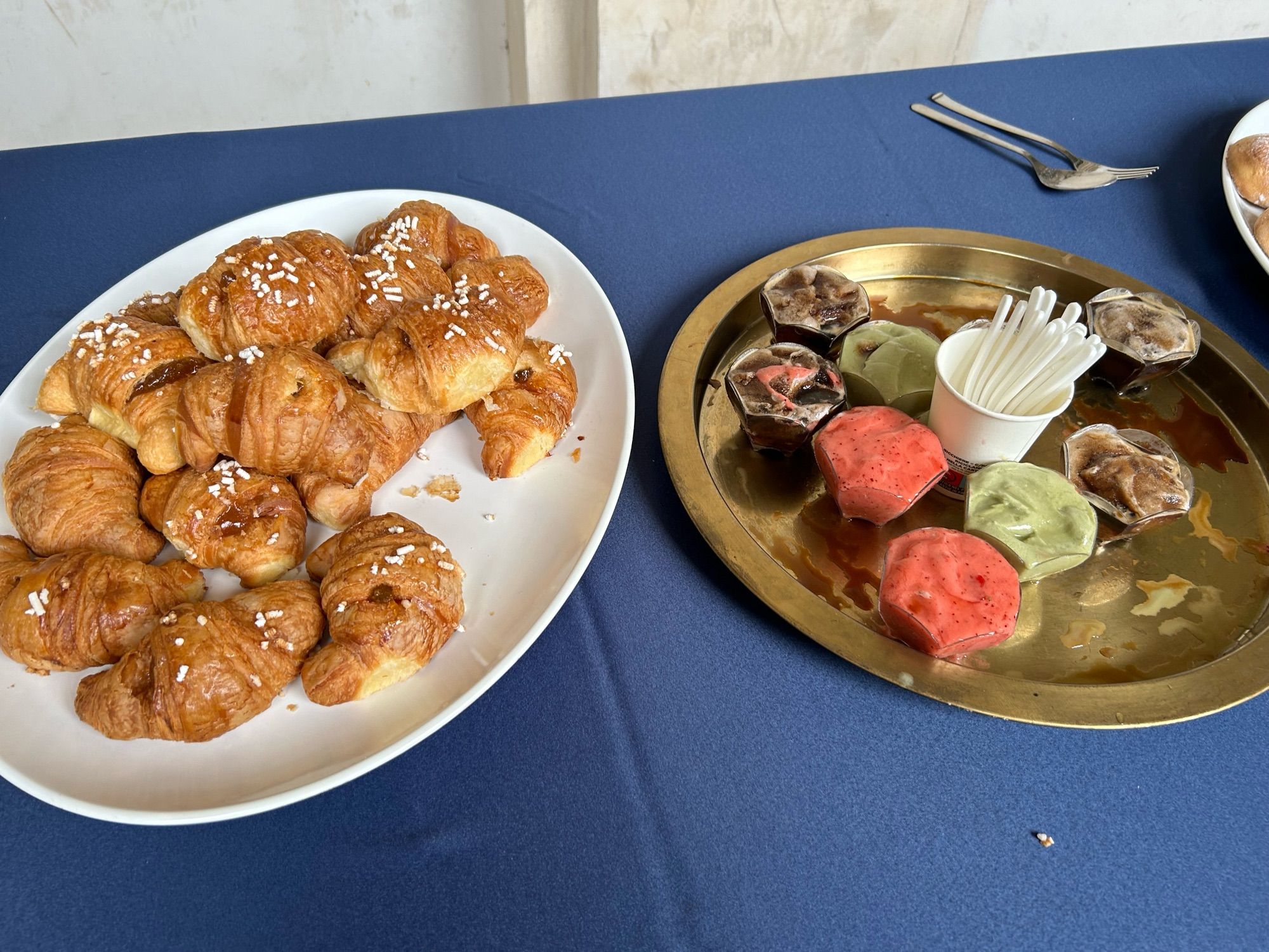 Croissant and ice cream on a table