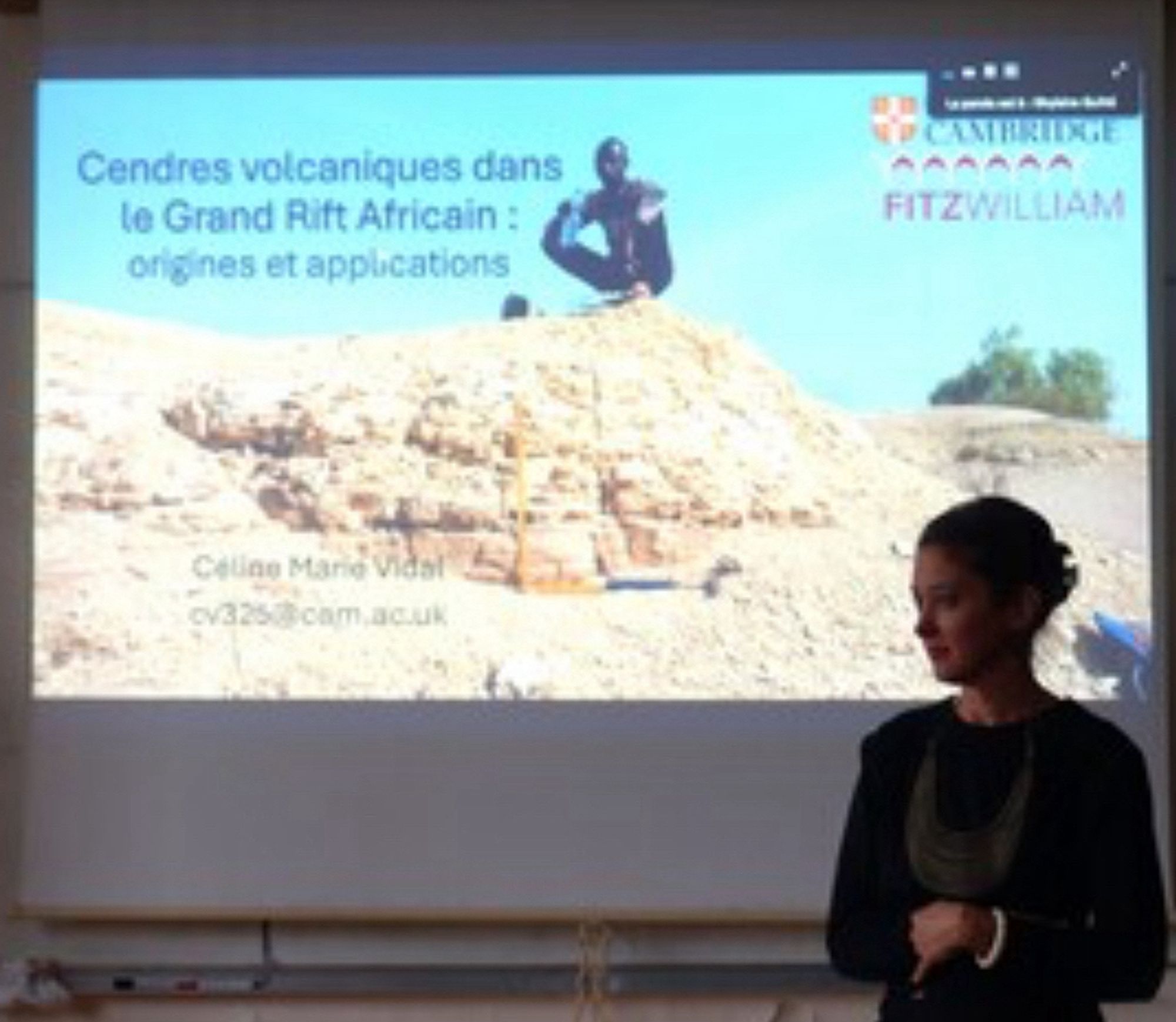 Céline Marie in front of a projected slide as she gave a talk at the National History Museum in Paris