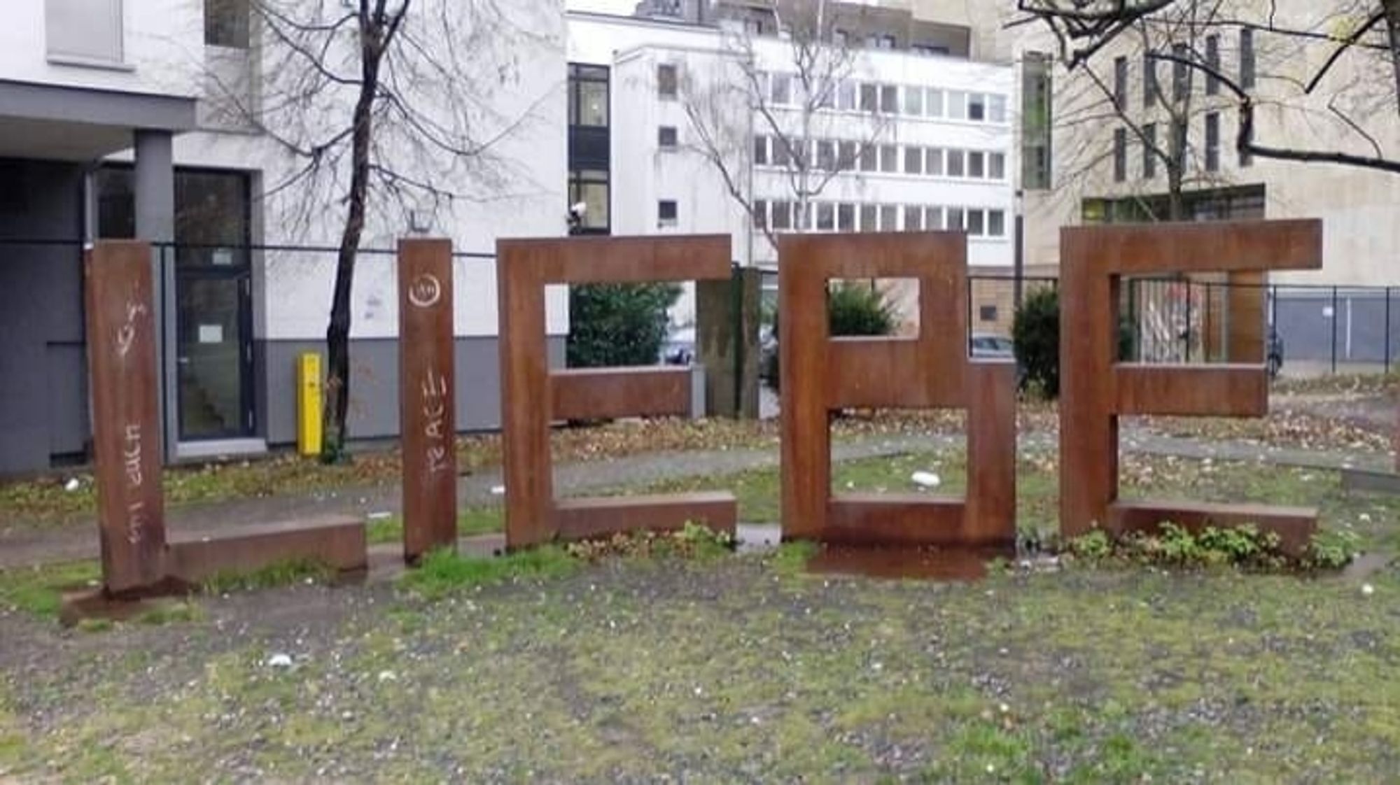 Rusty letters spell out LIEBE (Love) in a park in Frankfurt.