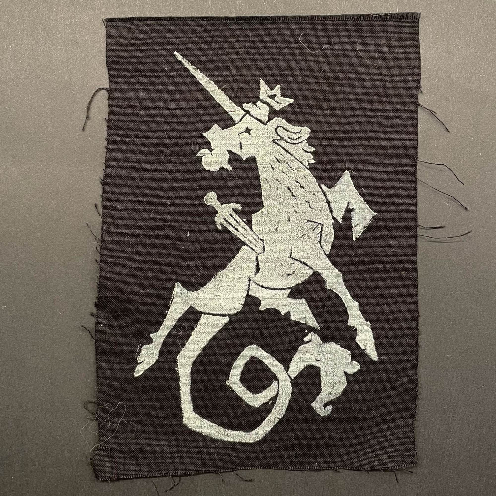 White ink unicorn print on black cotton