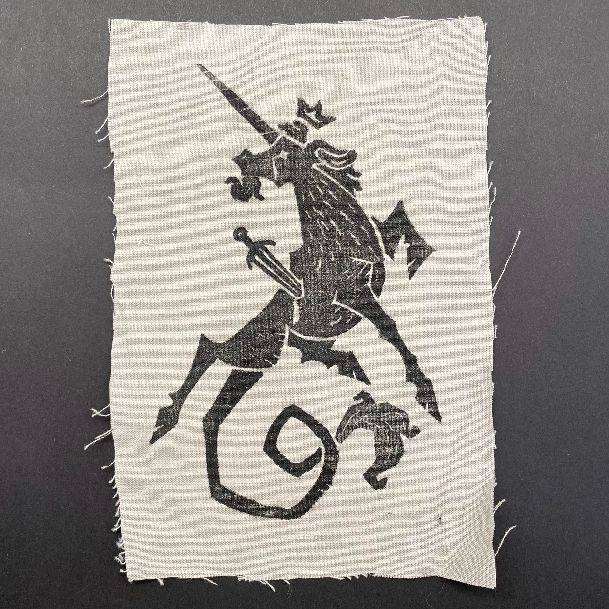 Black ink unicorn print on light gray cotton