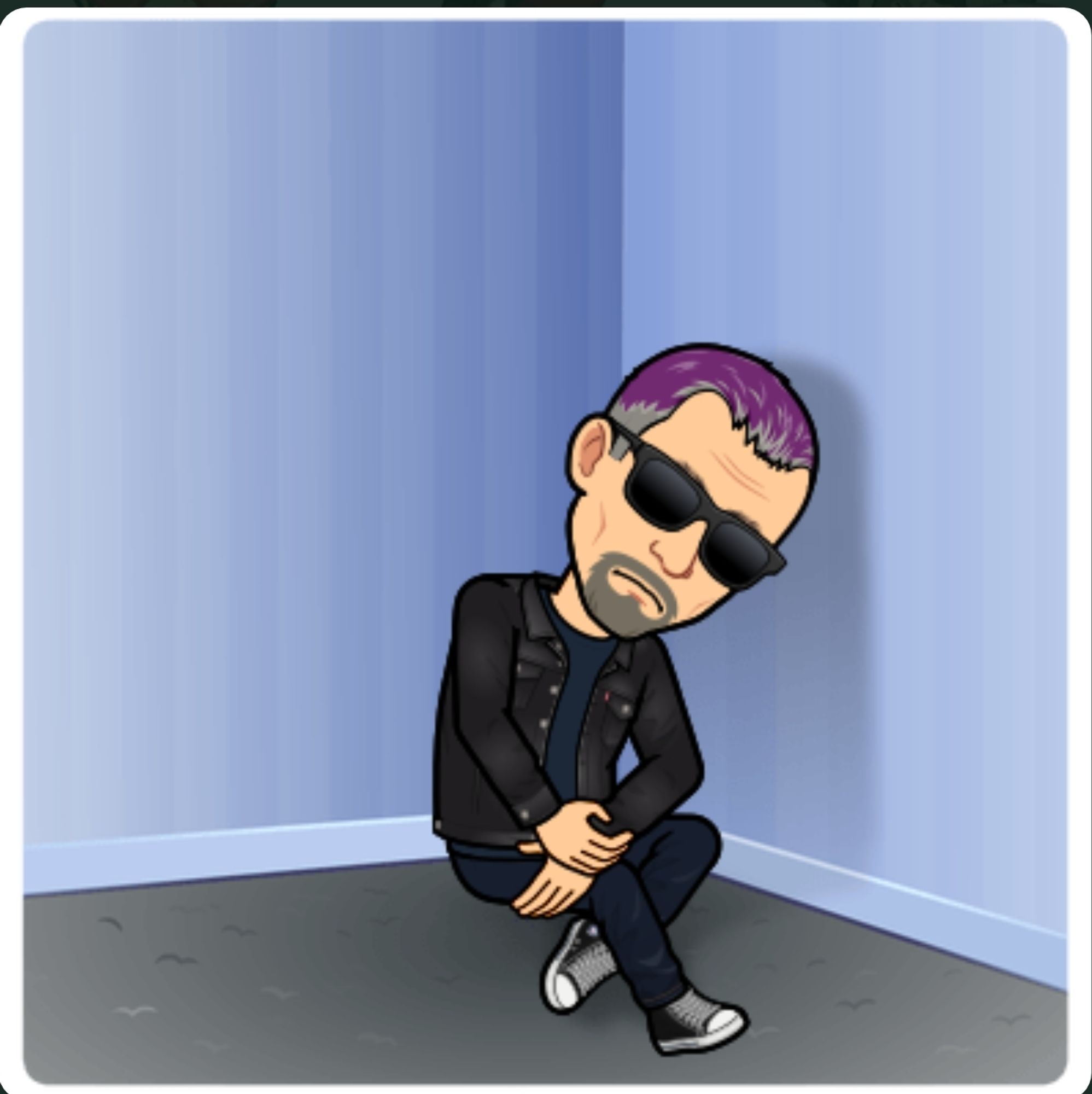 Bitmoji of me dressed in all black, sitting in the corner all lonely and shit.