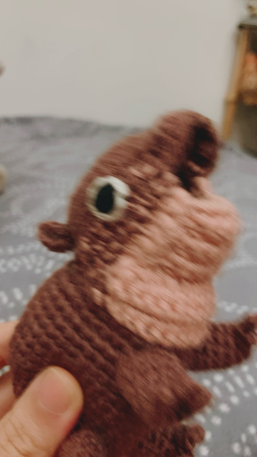 A crochet toy hippo moo deng.