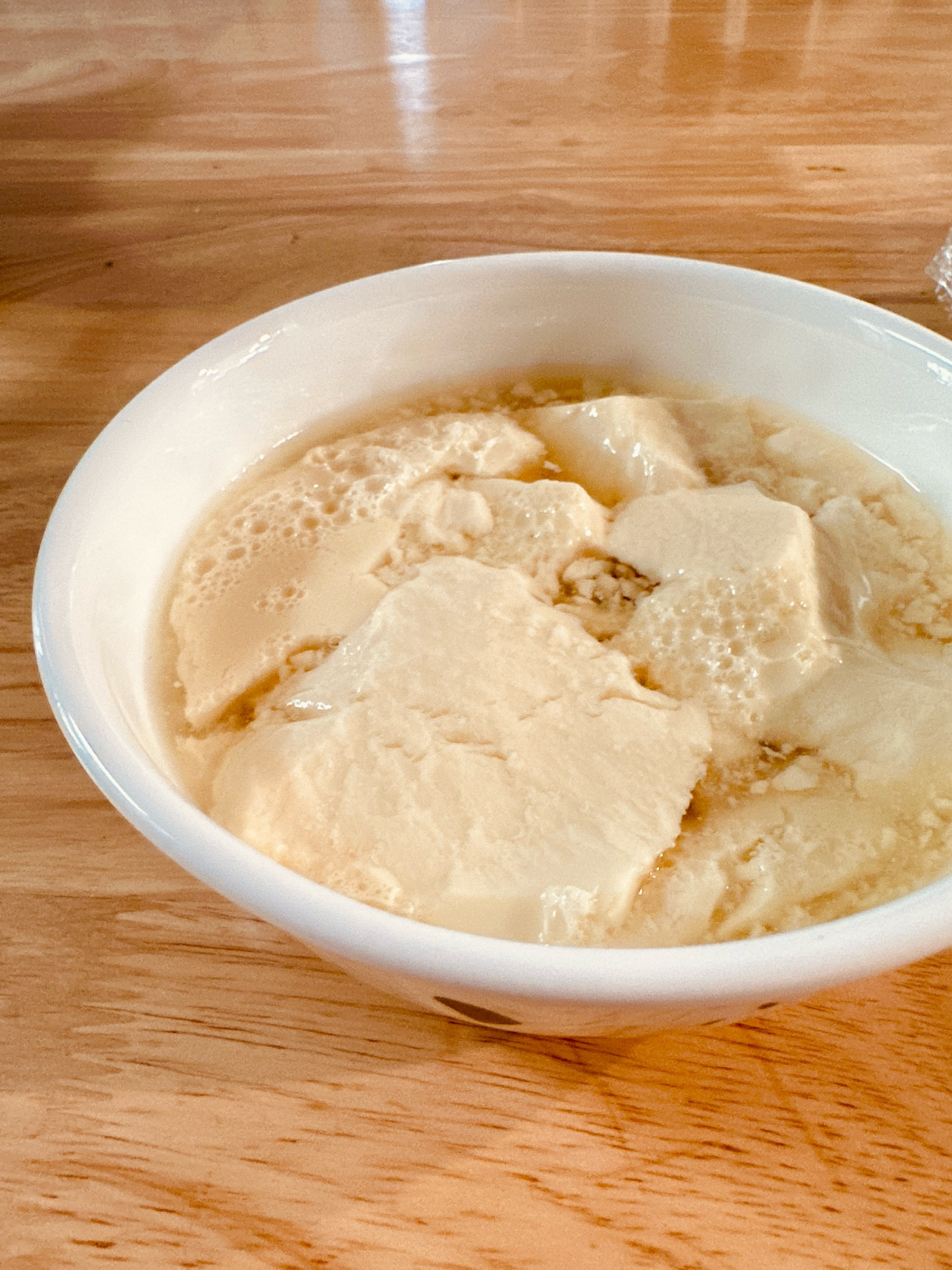 A bowl of tofu pudding dessert. 