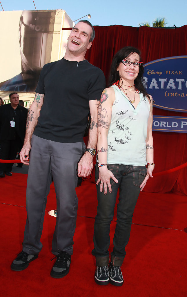 Henry Rollins and Janeane Garofalo standing shoulder to shoulder and hamming it up at the Ratatouille premiere.