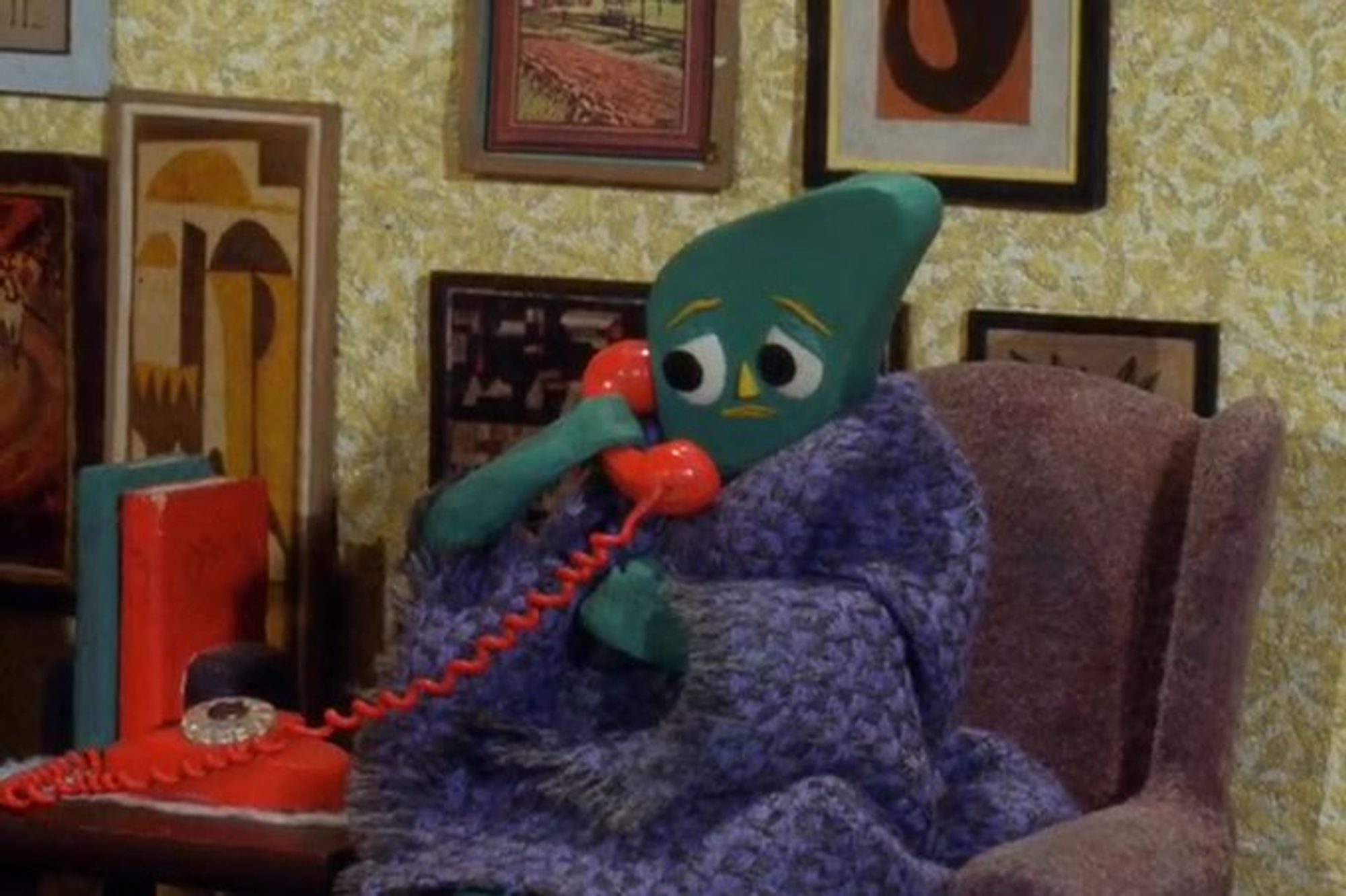 Gumby has a disconcerted look on his face and is wrapped in a blanket as he talks on the phone.

One could probably assume that he is not making a "prank call."