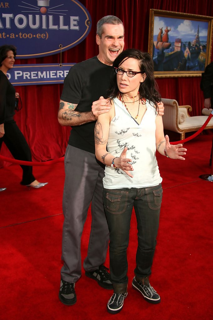 Henry Rollins holds Janeane Garofalo by the shoulders and smiles devilishly at the premiere of Ratatouille.

Janeane Garofalo doesn't appear to be quite as euphoric as Henry Rollins, but still, good times.