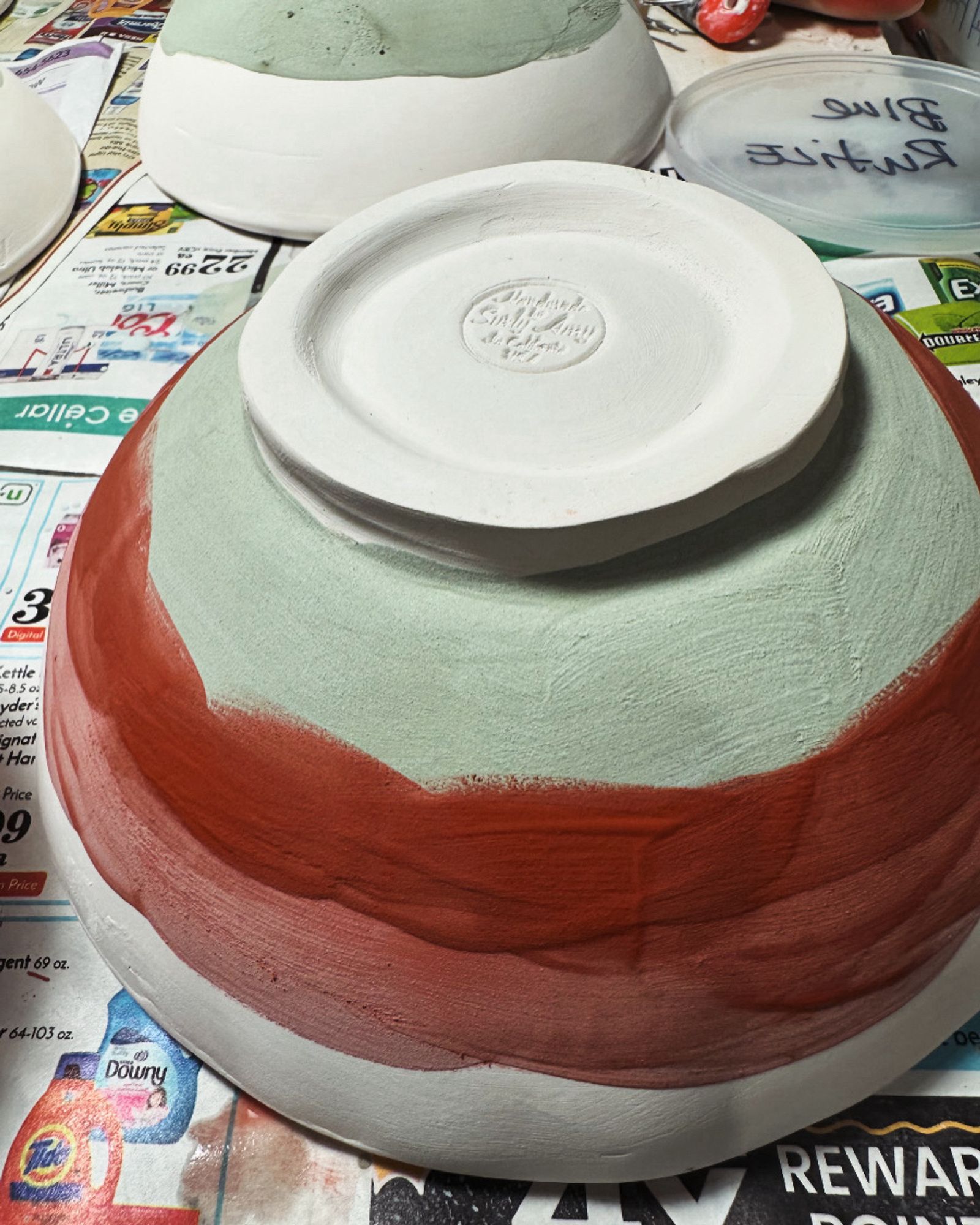 A ceramic bowl being glazed