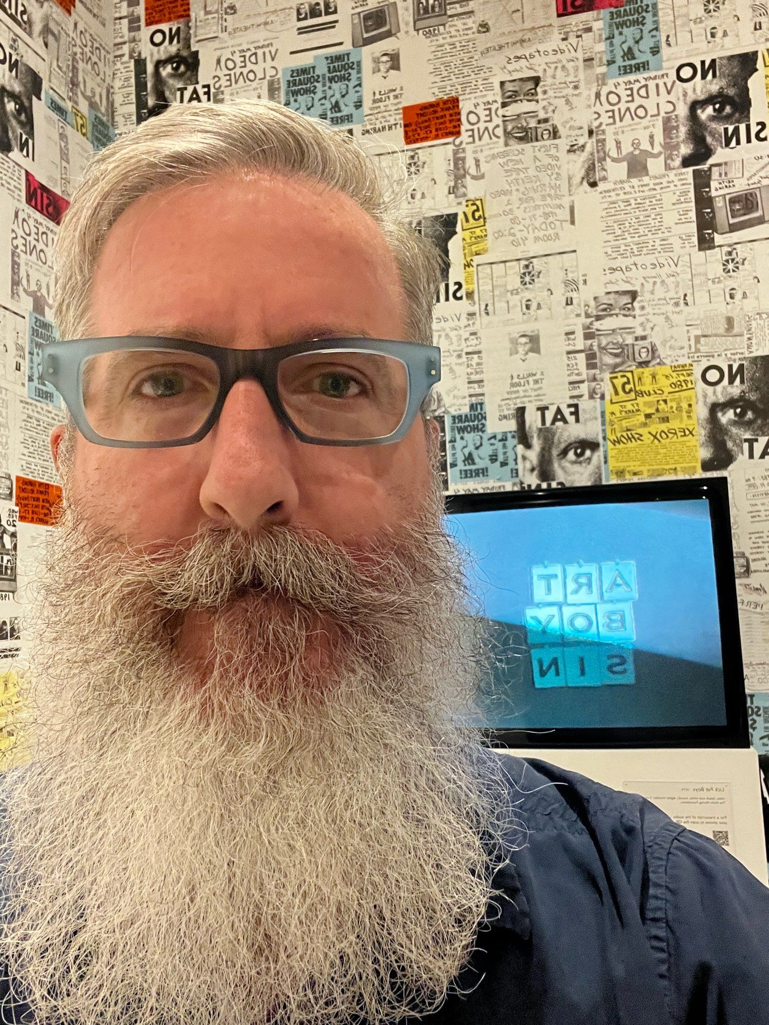 Yours truly in front of a monitor showing footage of Keith Haring, circa 1980, doing a version of wheel of fortune.