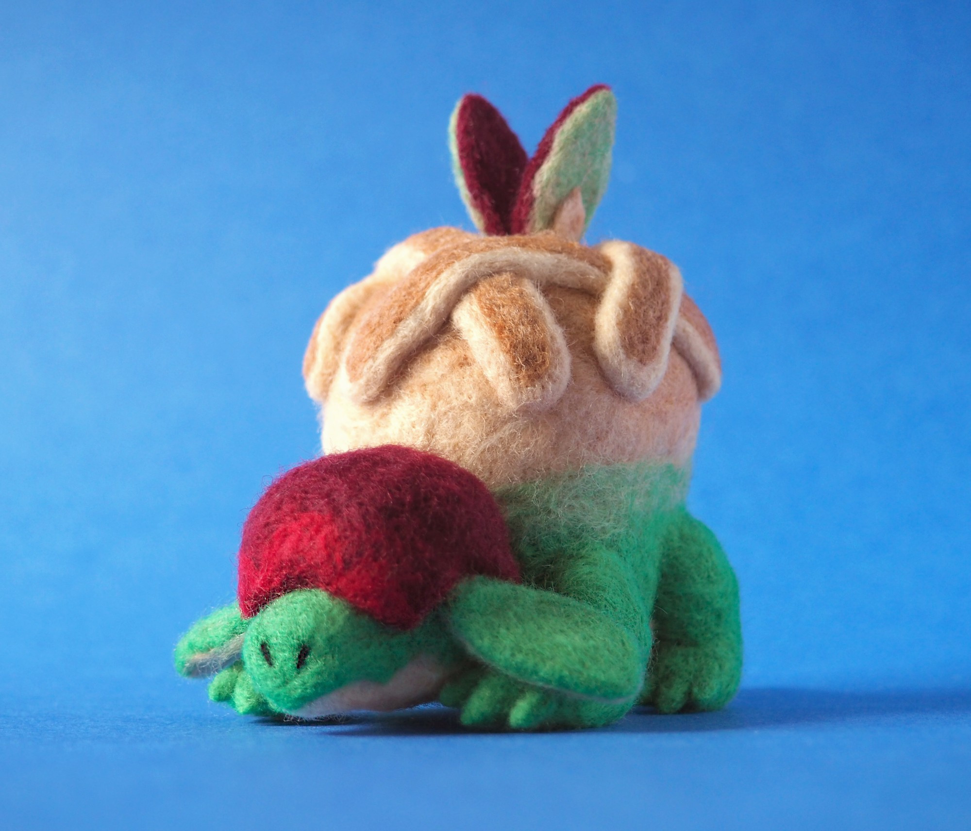 a wool soft sculpture of appletun from pokemon