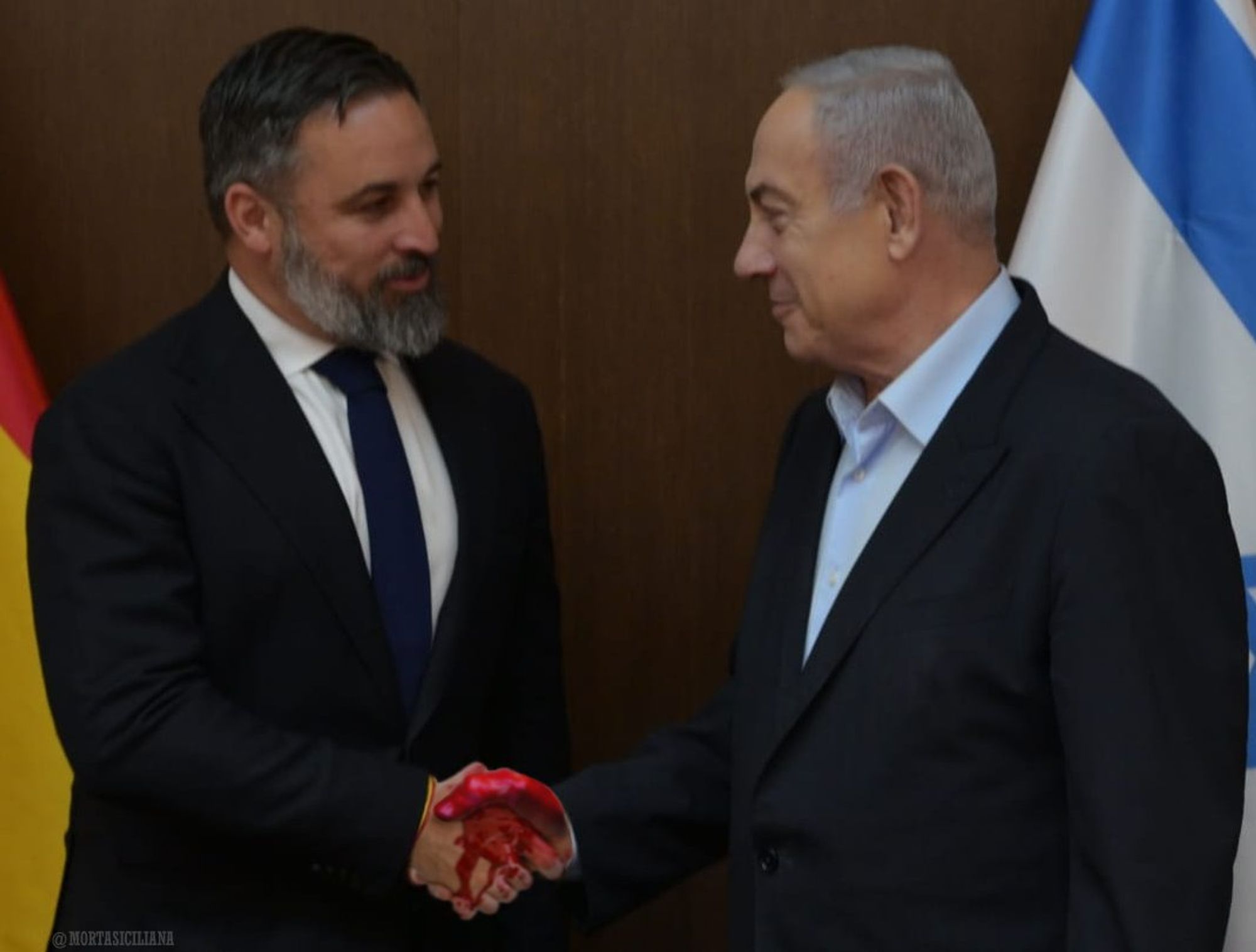 Netanyahu y Abascal dándose la mano en un apretón de manos sangriento.