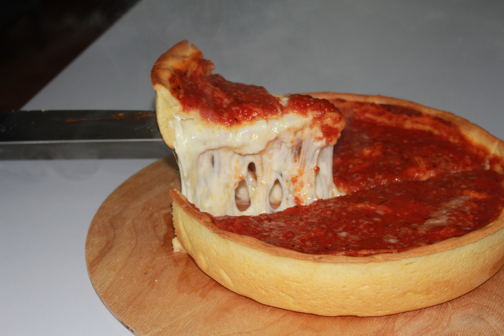 Chicago-Style Deep Dish Pizza.  The cheese goes under the sauce.