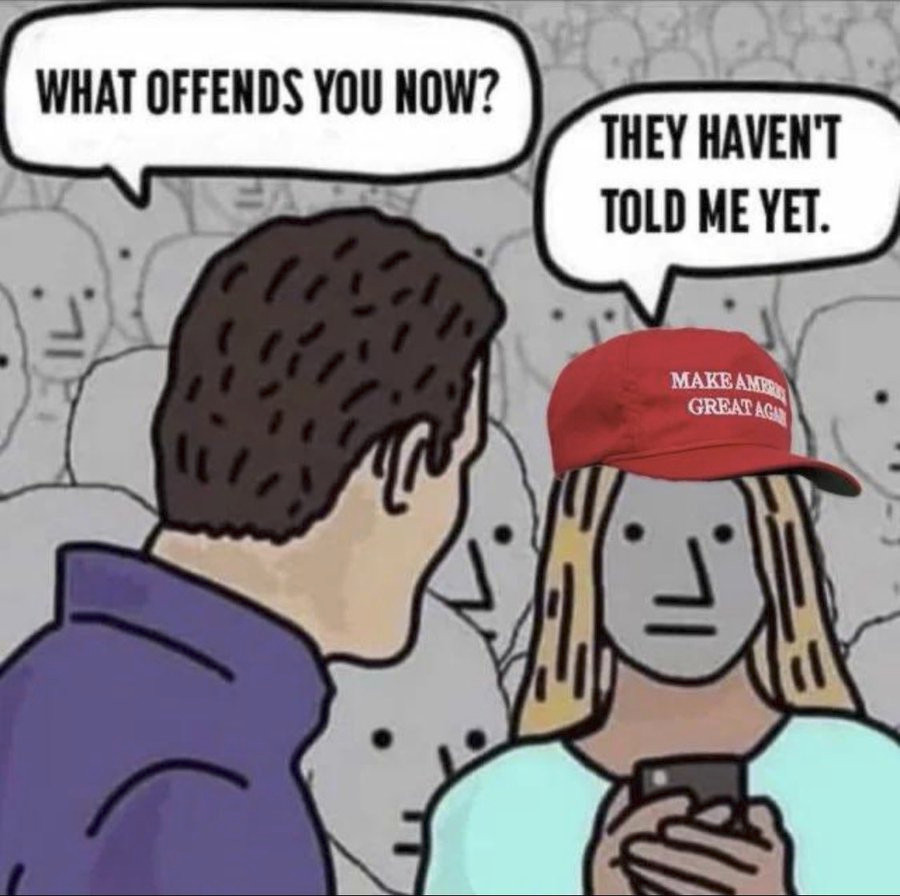 In front of a crowd of seemingly robotic looking people, a man on the left half of the image asks, "What offends you now?" and a seemingly robotic looking person wearing a red "Make America Great Again" hat and holding a smartphone on the right half answers with, "They haven't told me yet."
