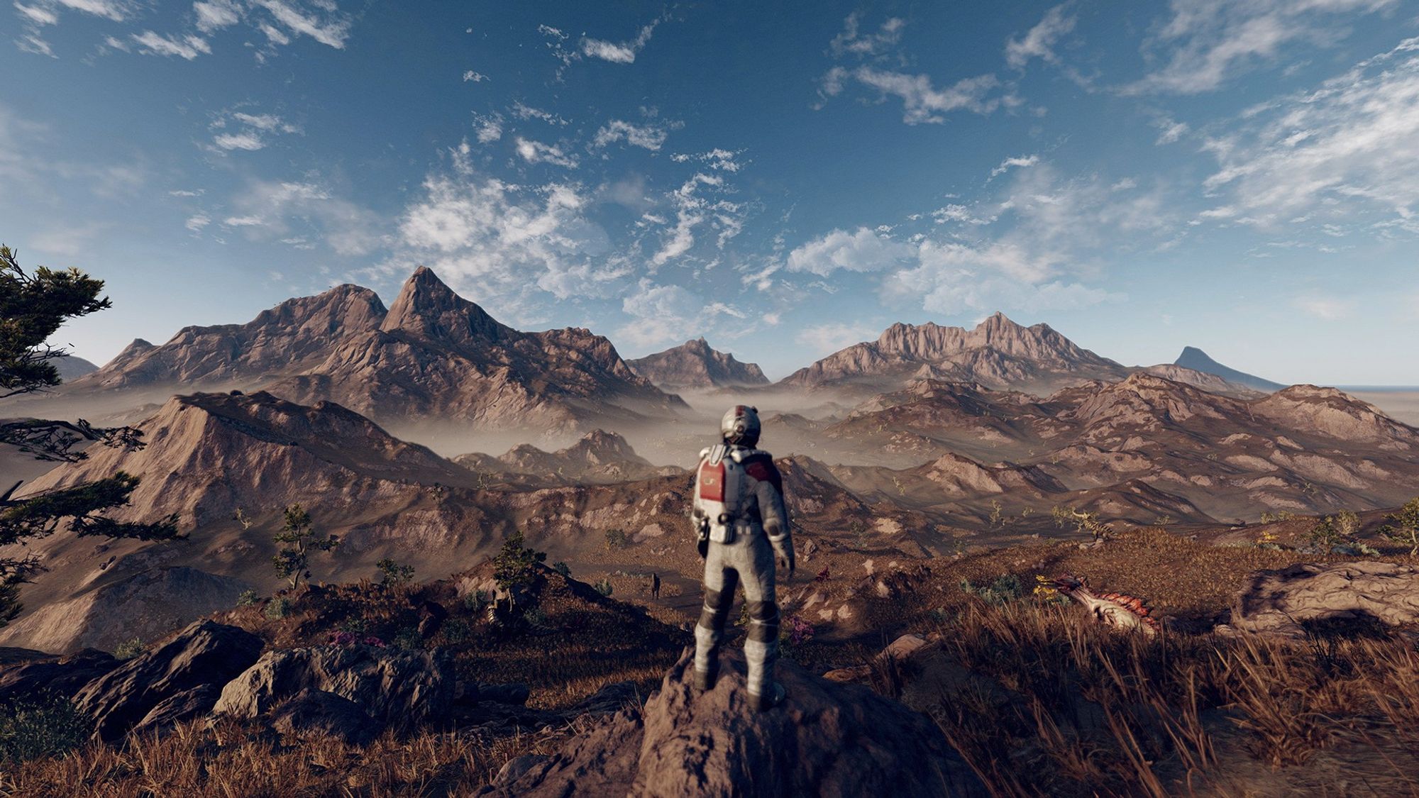 A video game astronaut, center screen, overlooks a rugged alien landscape.