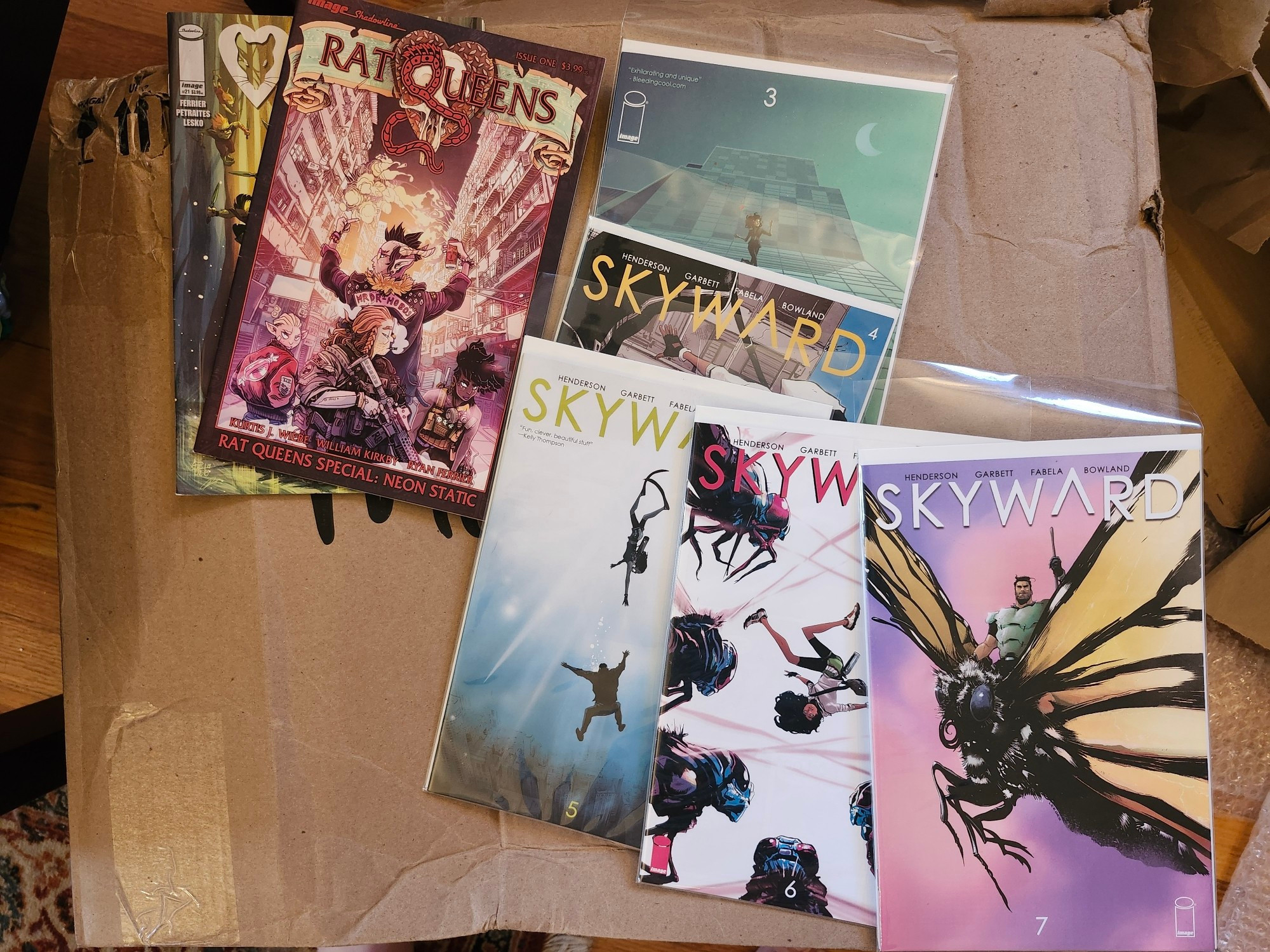 Rat Queens 21 and the Neon Static special, alongside Skyward issues 3-7