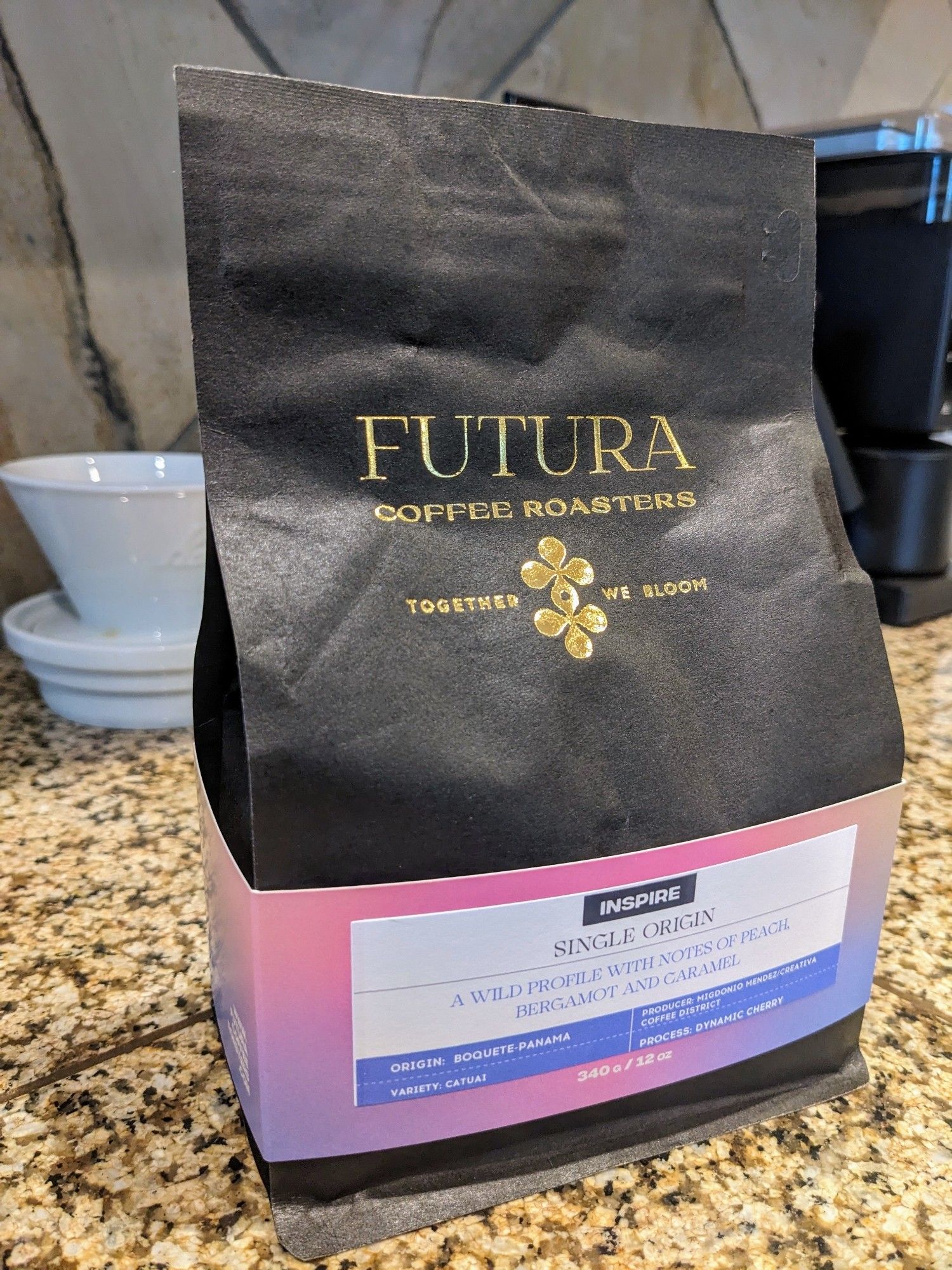 A bag of coffee beans from Futura Coffee Roasters in Portland, Oregon. The coffee is a dynamic cherry processed single-origin lot from Panama, with tasting notes of peach, bergamot, and caramel.