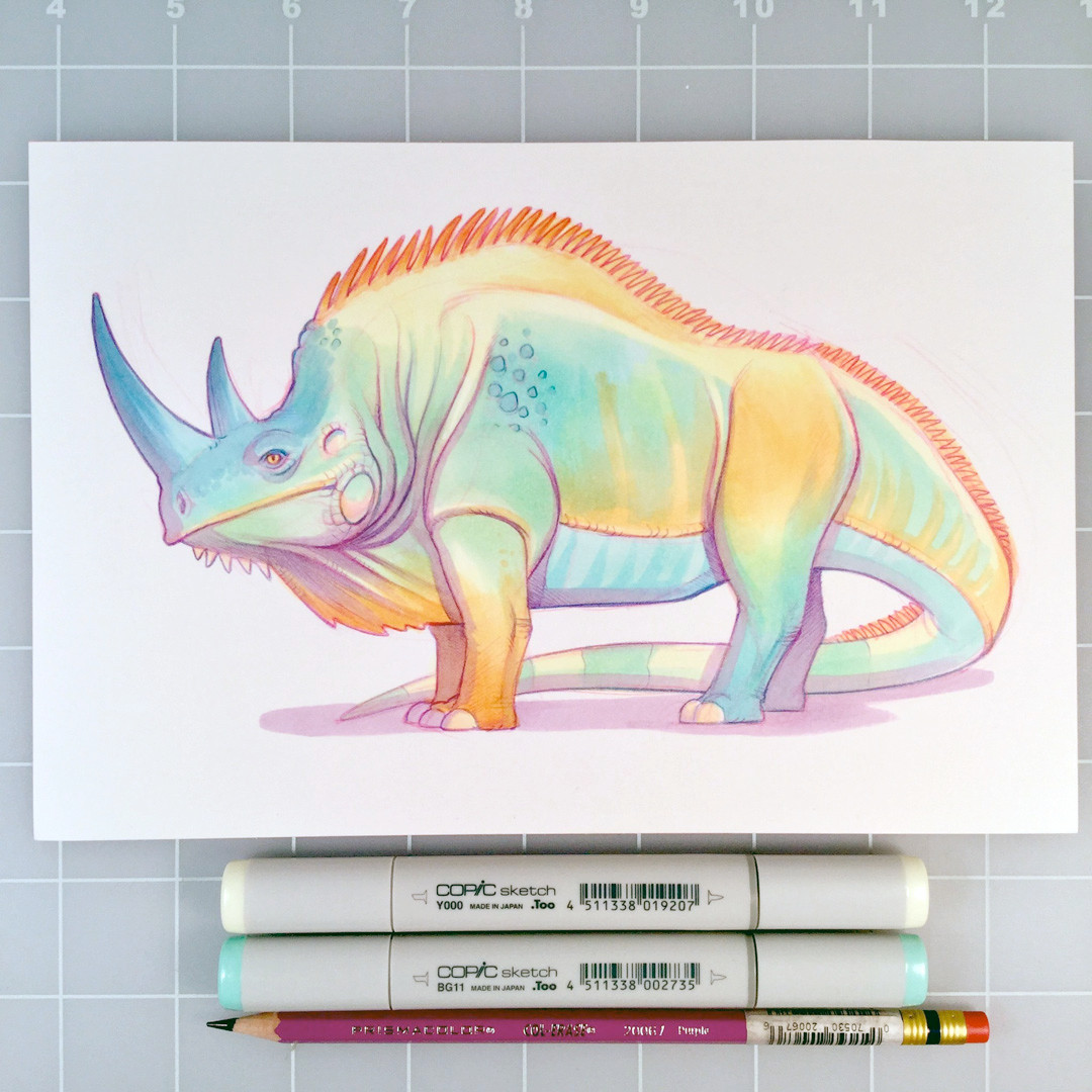 A coloured pencil/marker drawing of a hybrid iguana/rhinoceros.  Below the drawing are two Copic markers and a Col-Erase pencil.