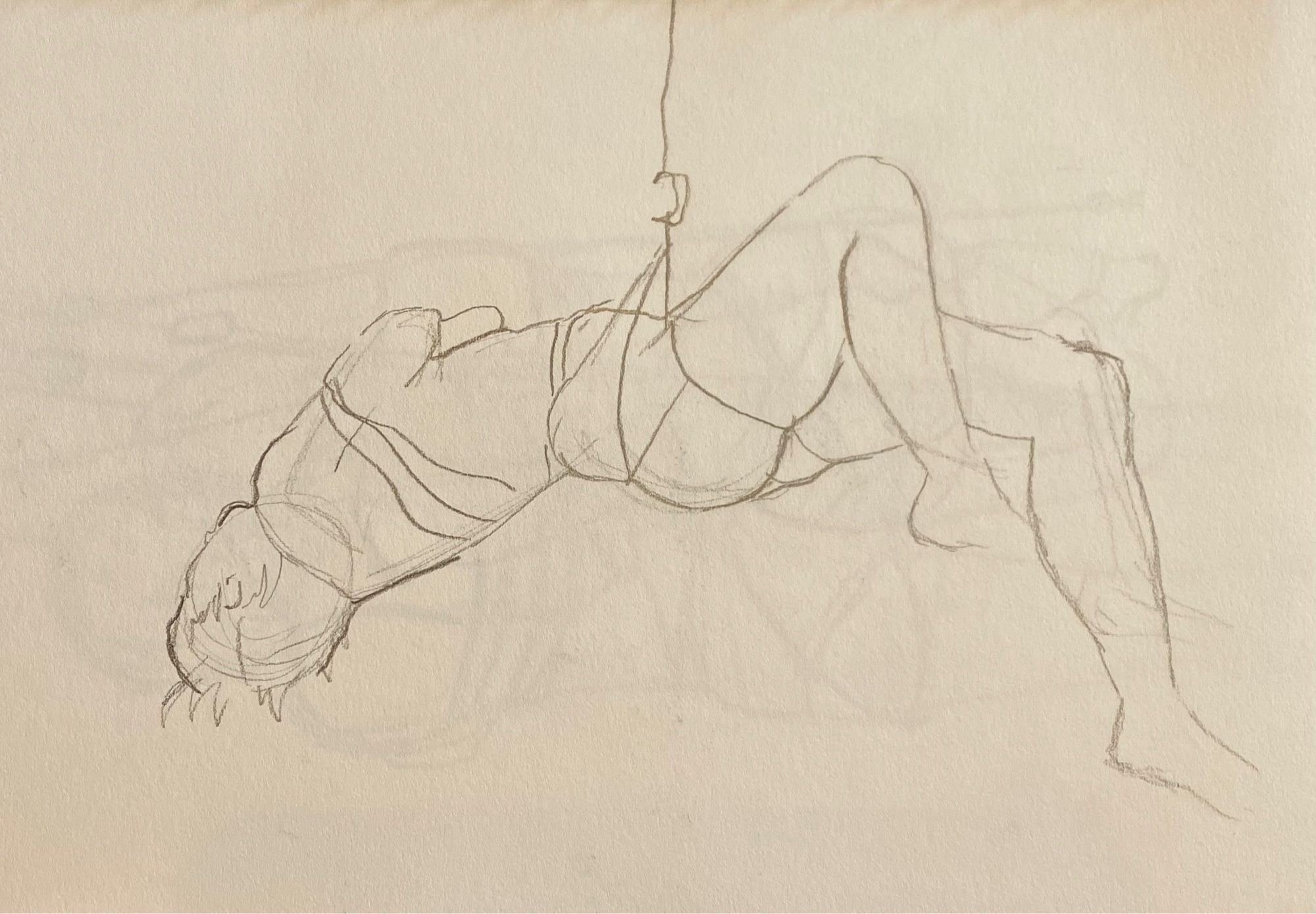 Pencil sketch of a person suspended in the air by a shibari rope. The rope is also wrapped around their arms and torso.