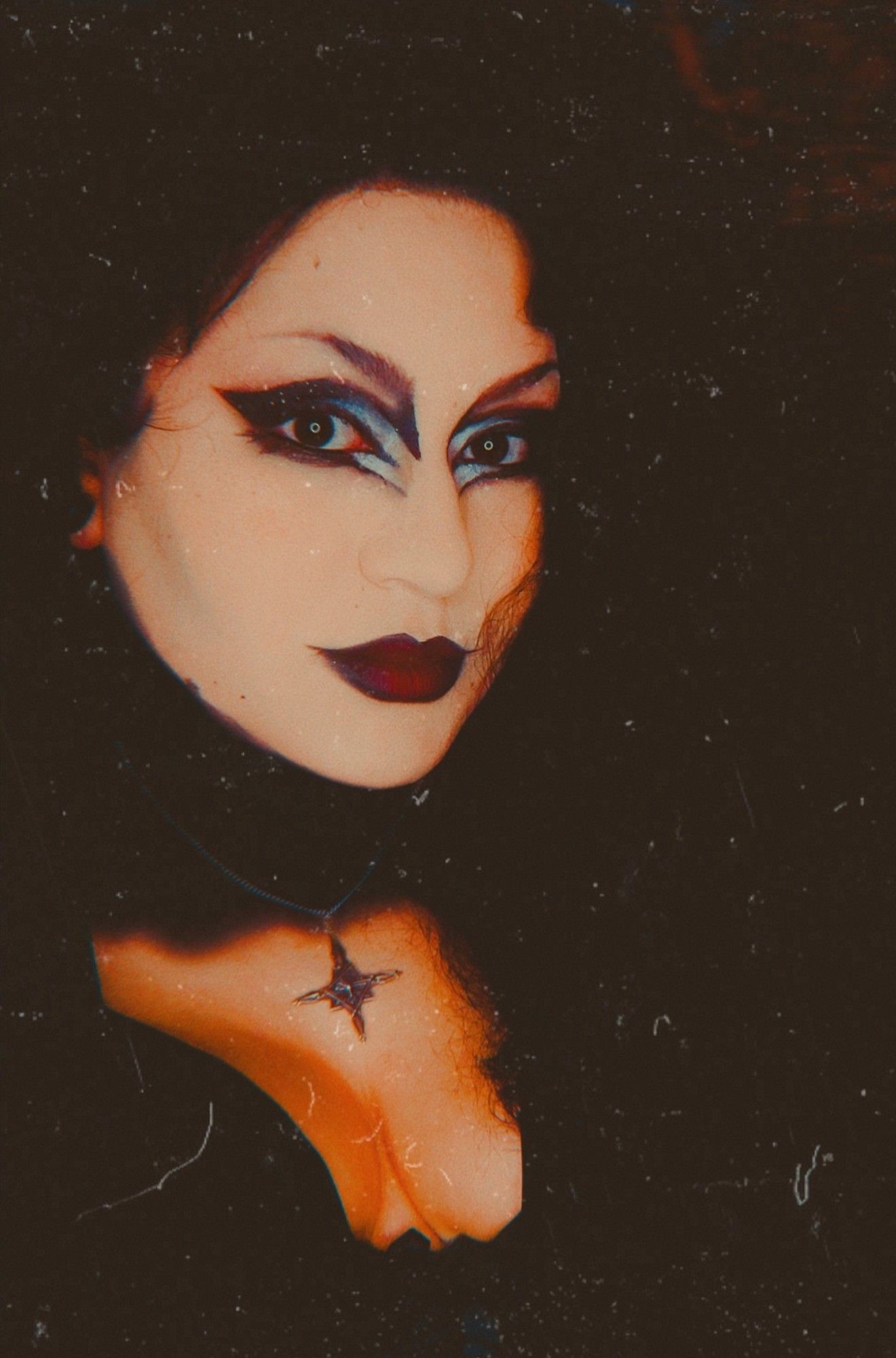 A woman in trad goth makeup