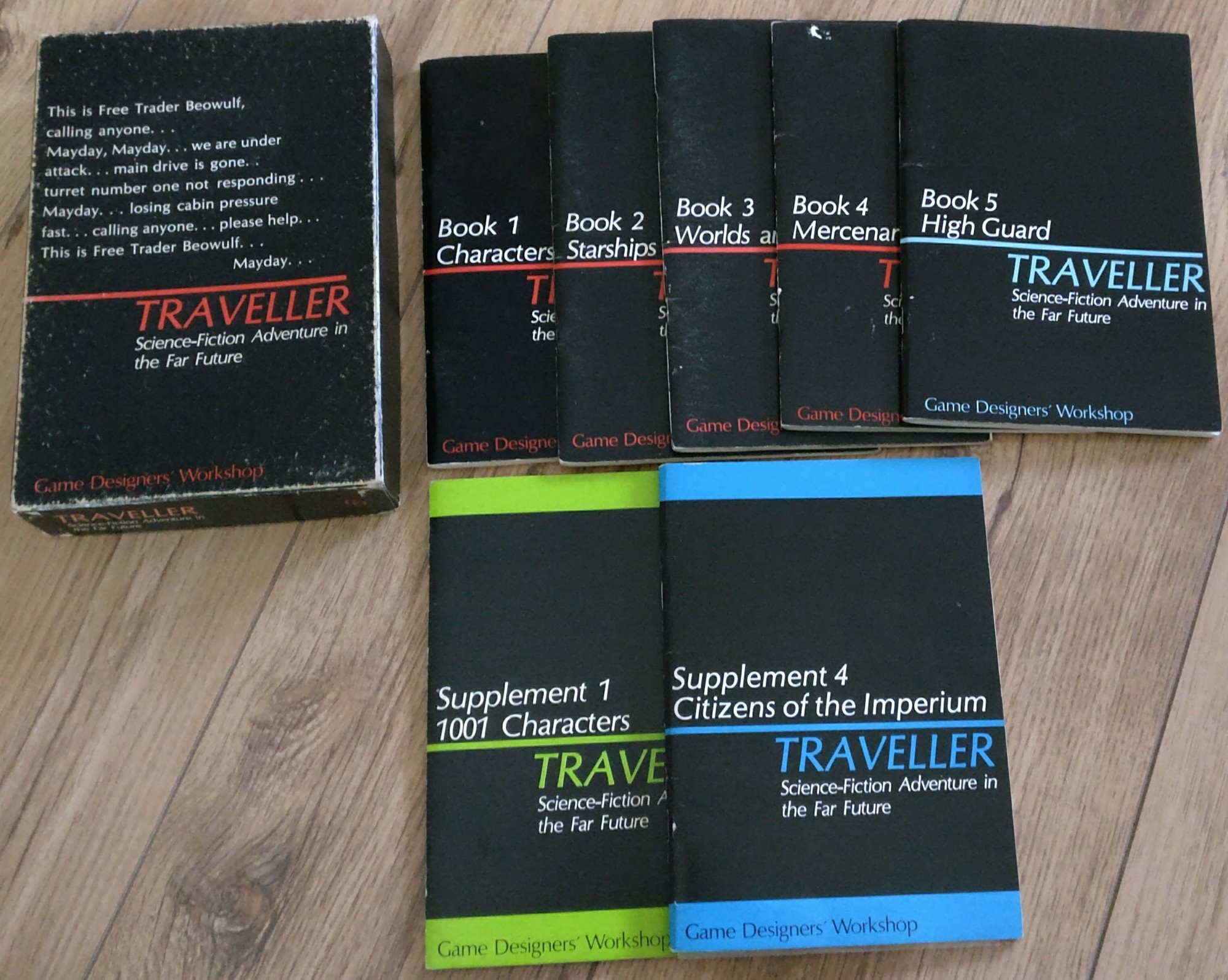 The box set of Traveller Little Black Books, with Mercenary, High Guard ( Books 4 & 5 ) , 1001 Characters & Citizens of the Imperium ( Supplements 1 & 4 )