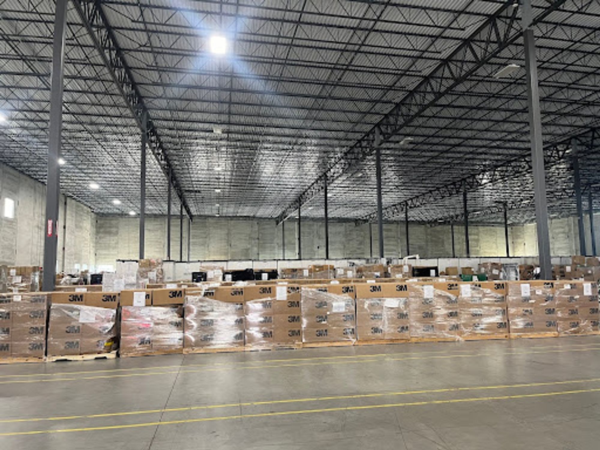 Pallets of boxes of 3M n95s in a warehouse in Louisville.